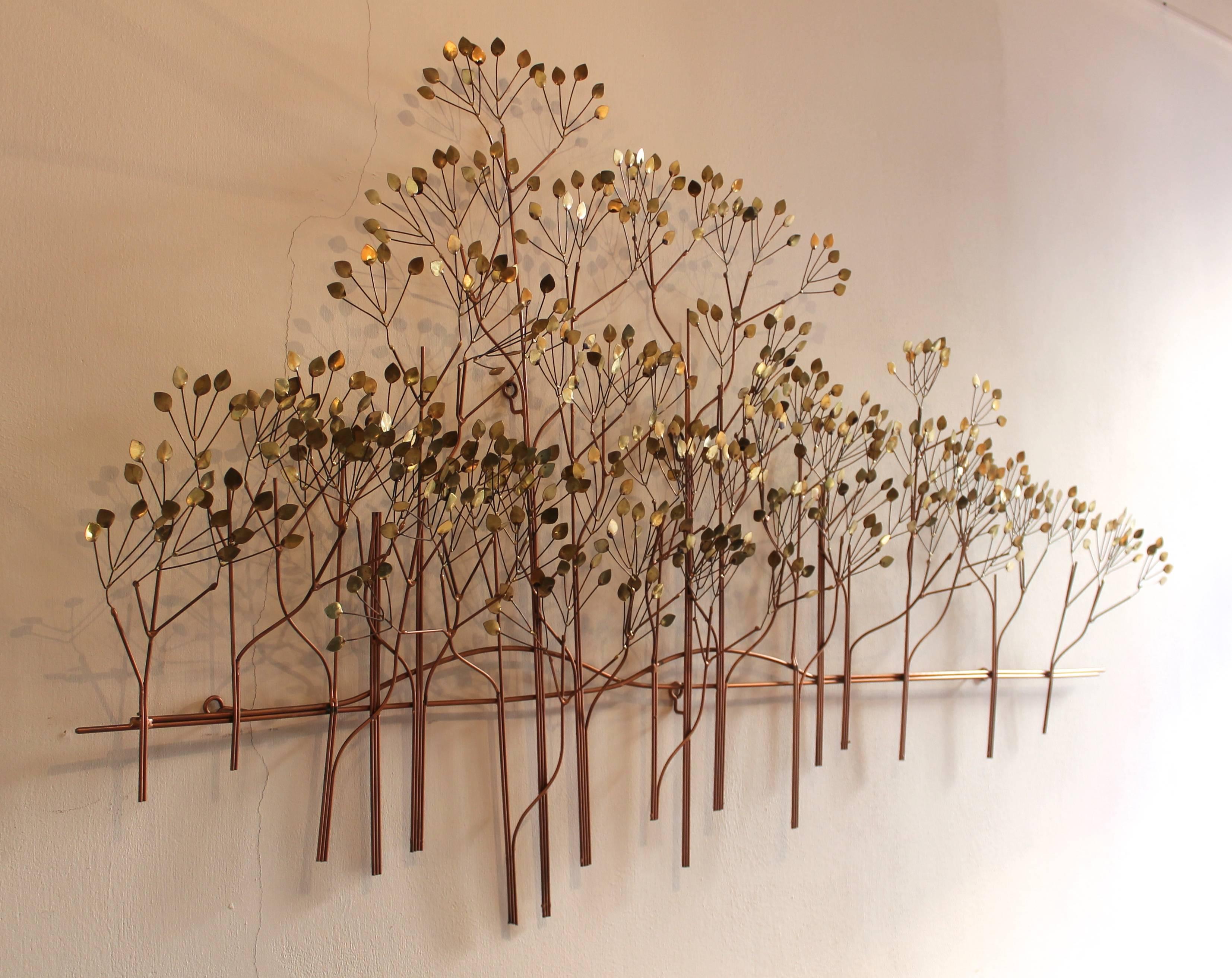 Trees by Curtis Jeré (US) in brass.

Wikipedia: 
C. Jere is a metalwork artist of wall sculptures and household accessories.
C. Jere works are made and marketed by the corporation Artisan House. Curtis Jere is a compound nom-de-plume of artists