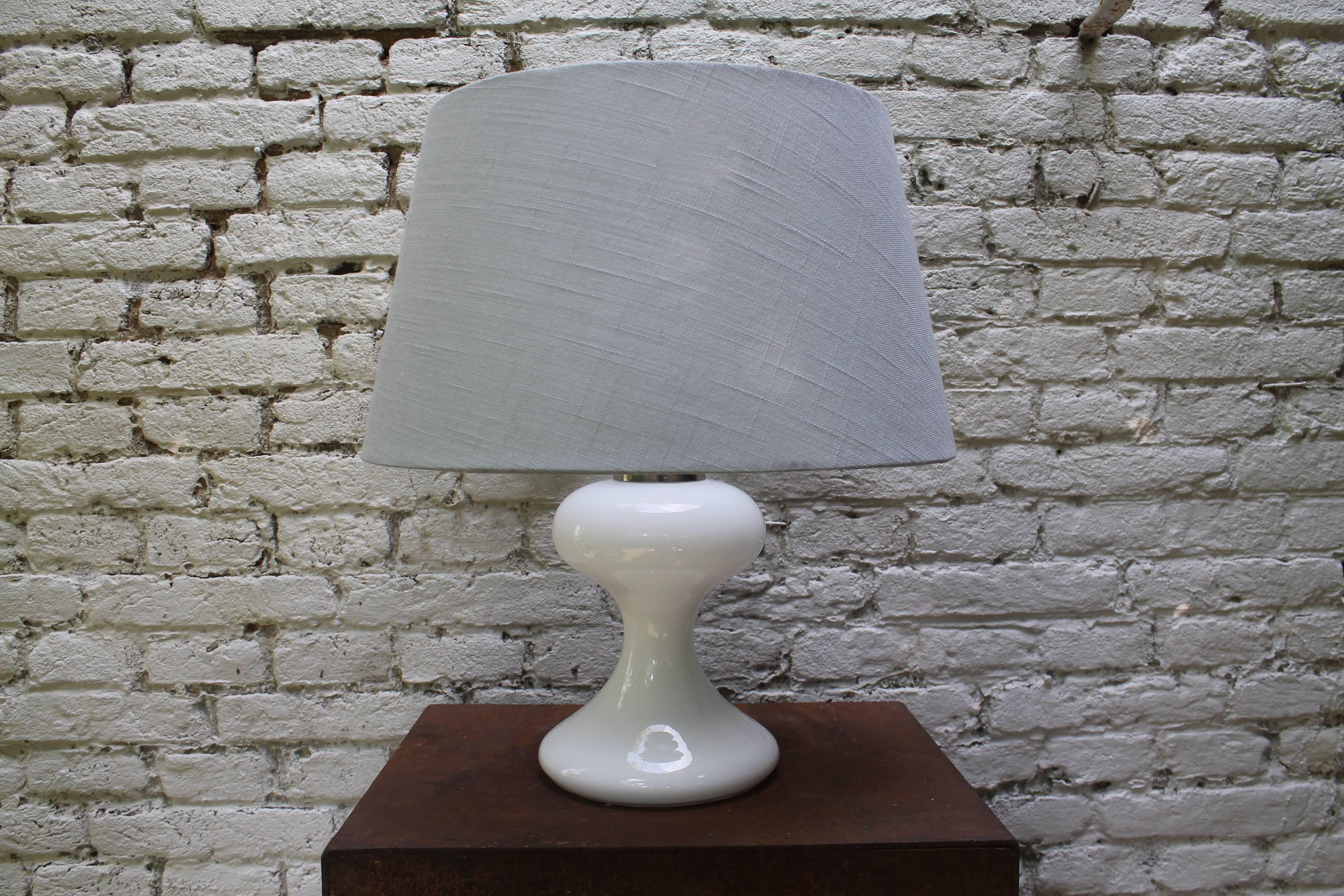 Pair of white glass Ingo Maurer table lamps with light blue shades.