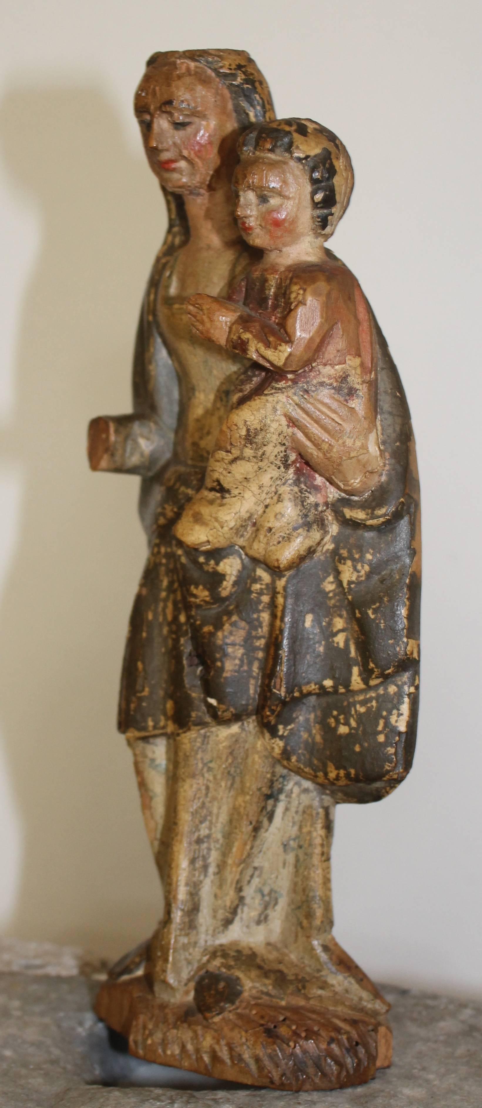Wood carved Madonna with child. Rests of polychrome, early 17th century.
Spanish or Flemish.