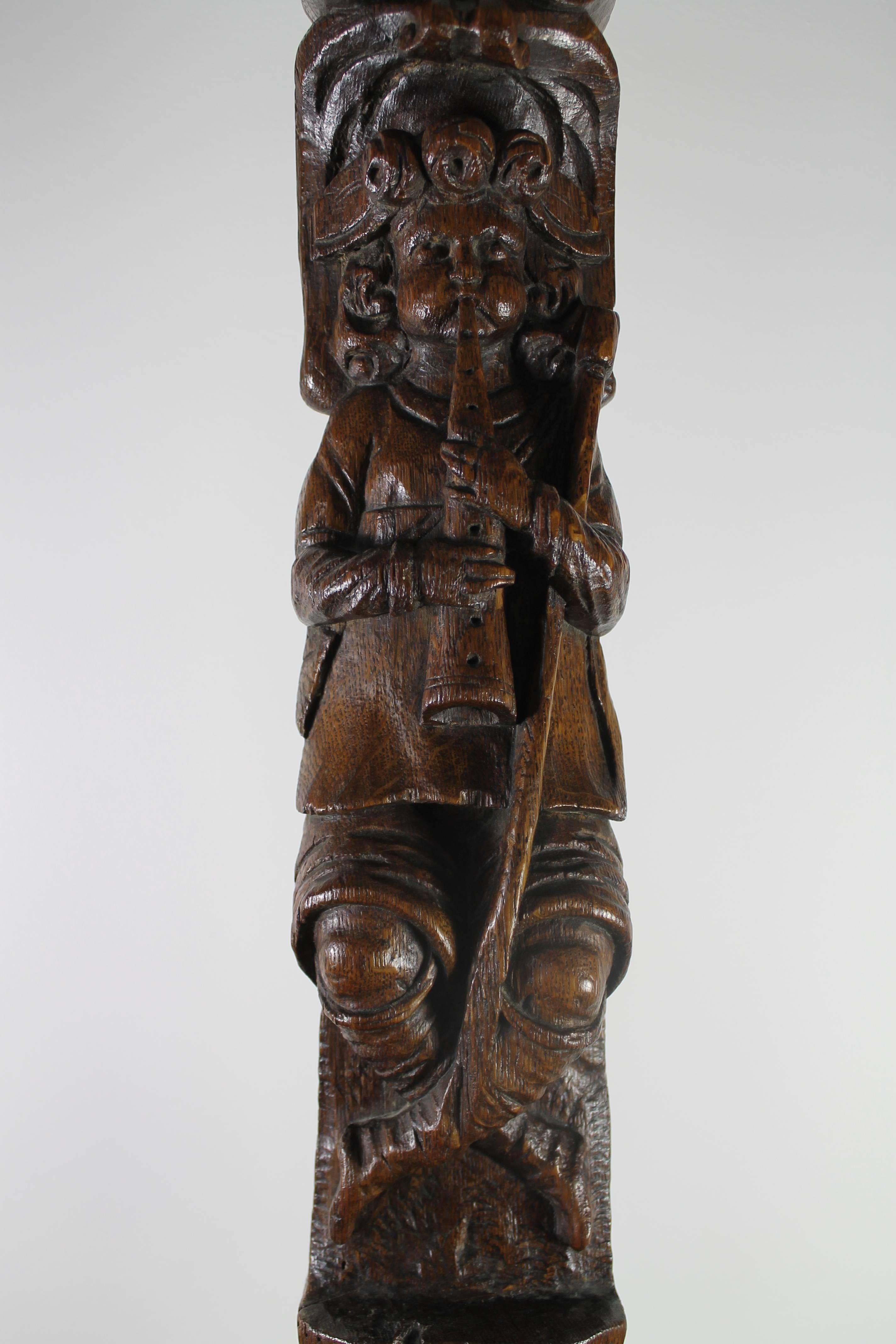 Flute Player in Oak,  Dutch, (Probably an Ornament), 17th century,
Standing on an Iron Base