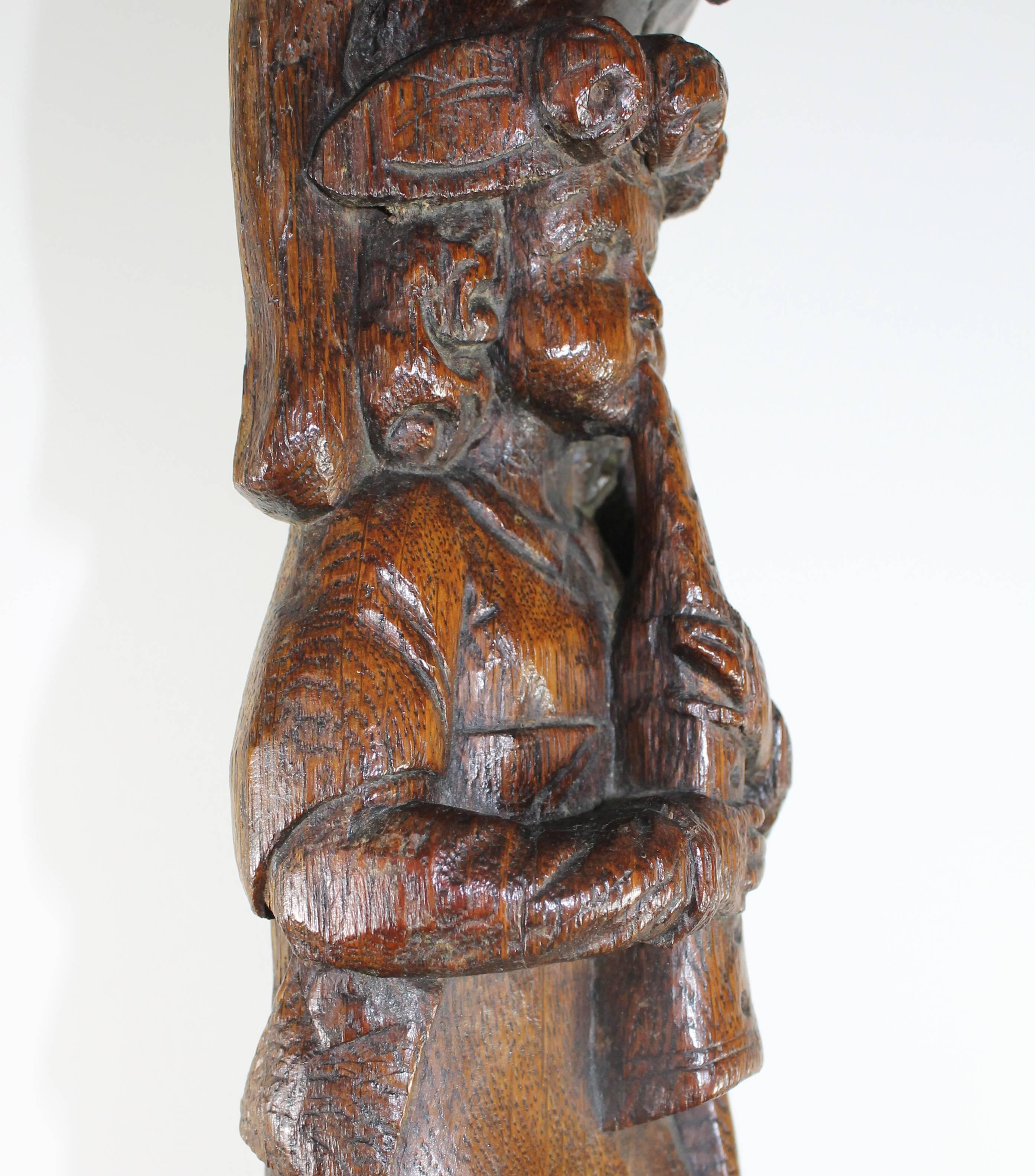 Hand-Carved Flute Player in Oak, 17th Century For Sale