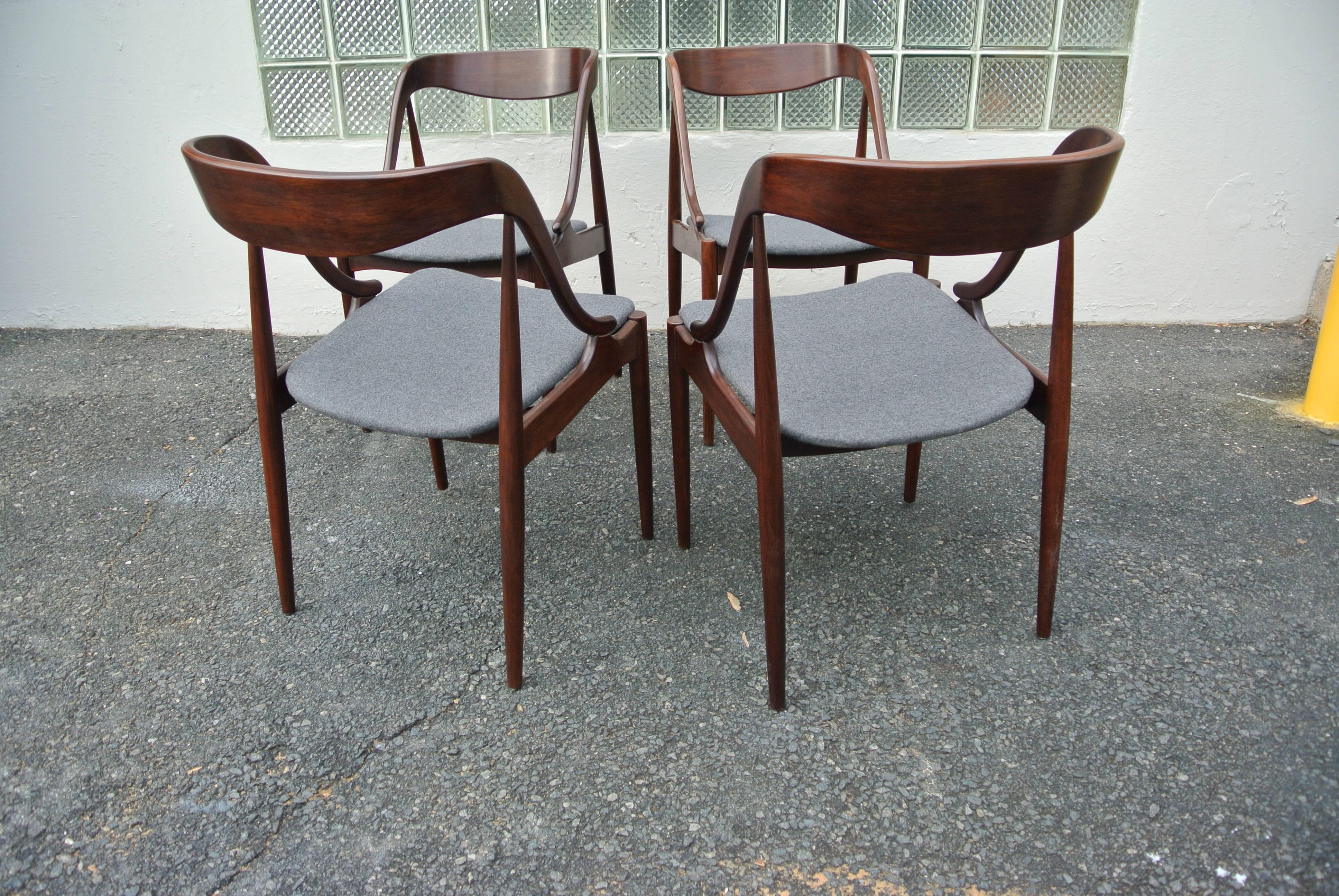 Gorgeous rosewood dining chairs by Johannes Andersen. Sculpted bentwood side chairs, newly refinished and newly upholstered Italian wool herringbone fabric.