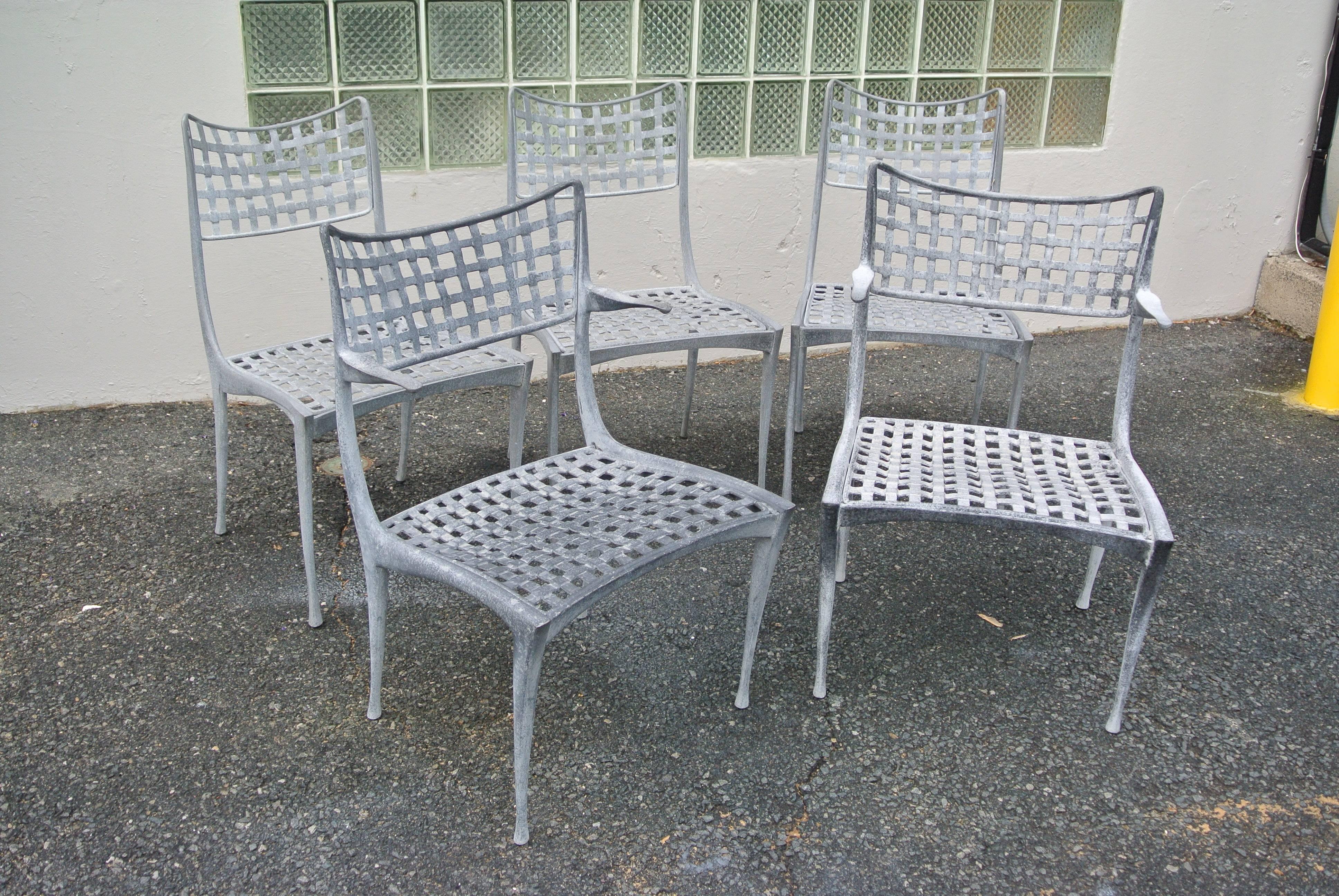 Set of five Sol Y Luna aluminum patio chairs by Brown Jordan. The set includes two armchairs and three side chairs.