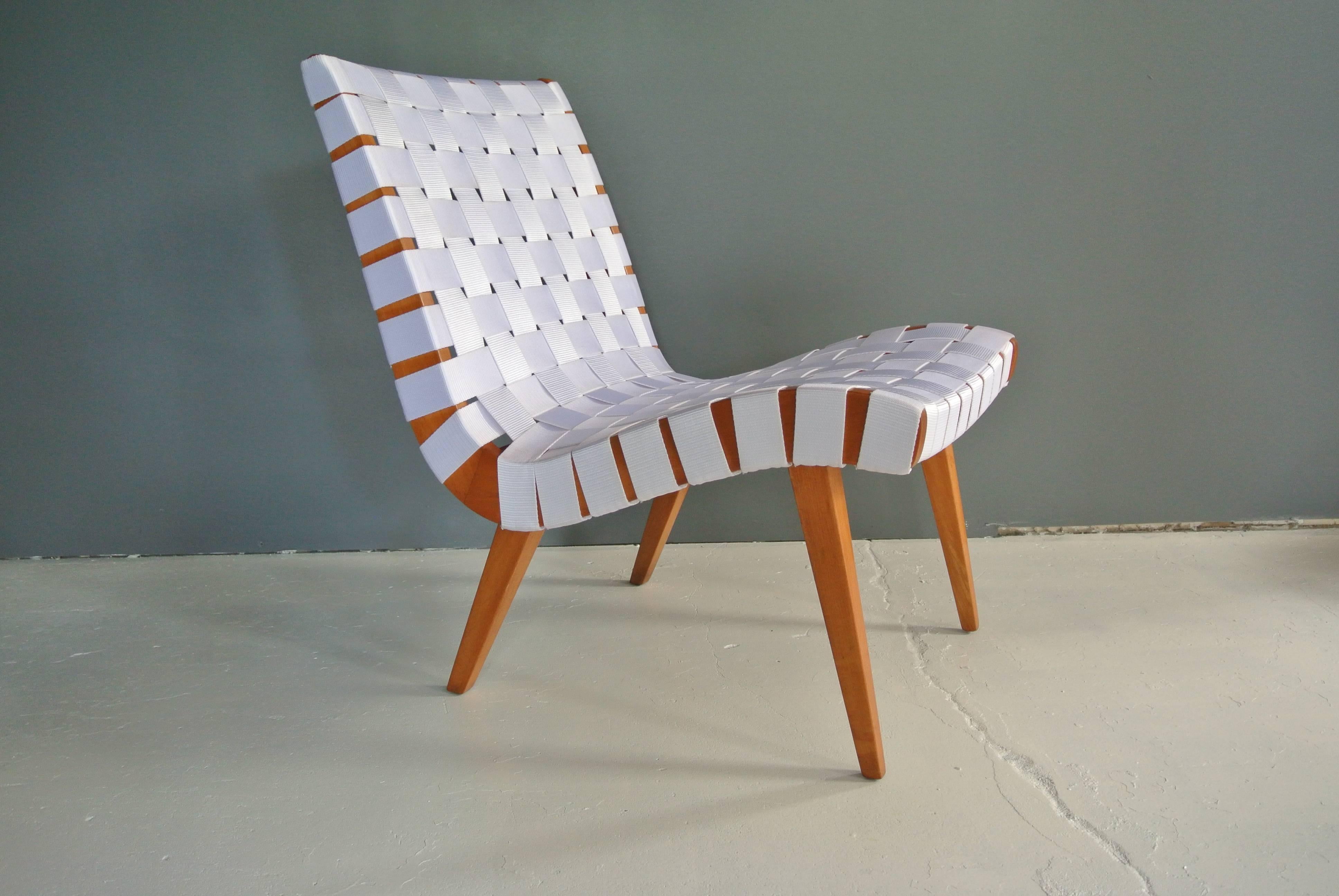 Newly refinished webbed lounge chair in birch by Jens Risom. Webbing is a white vinyl. Signed Knoll International.