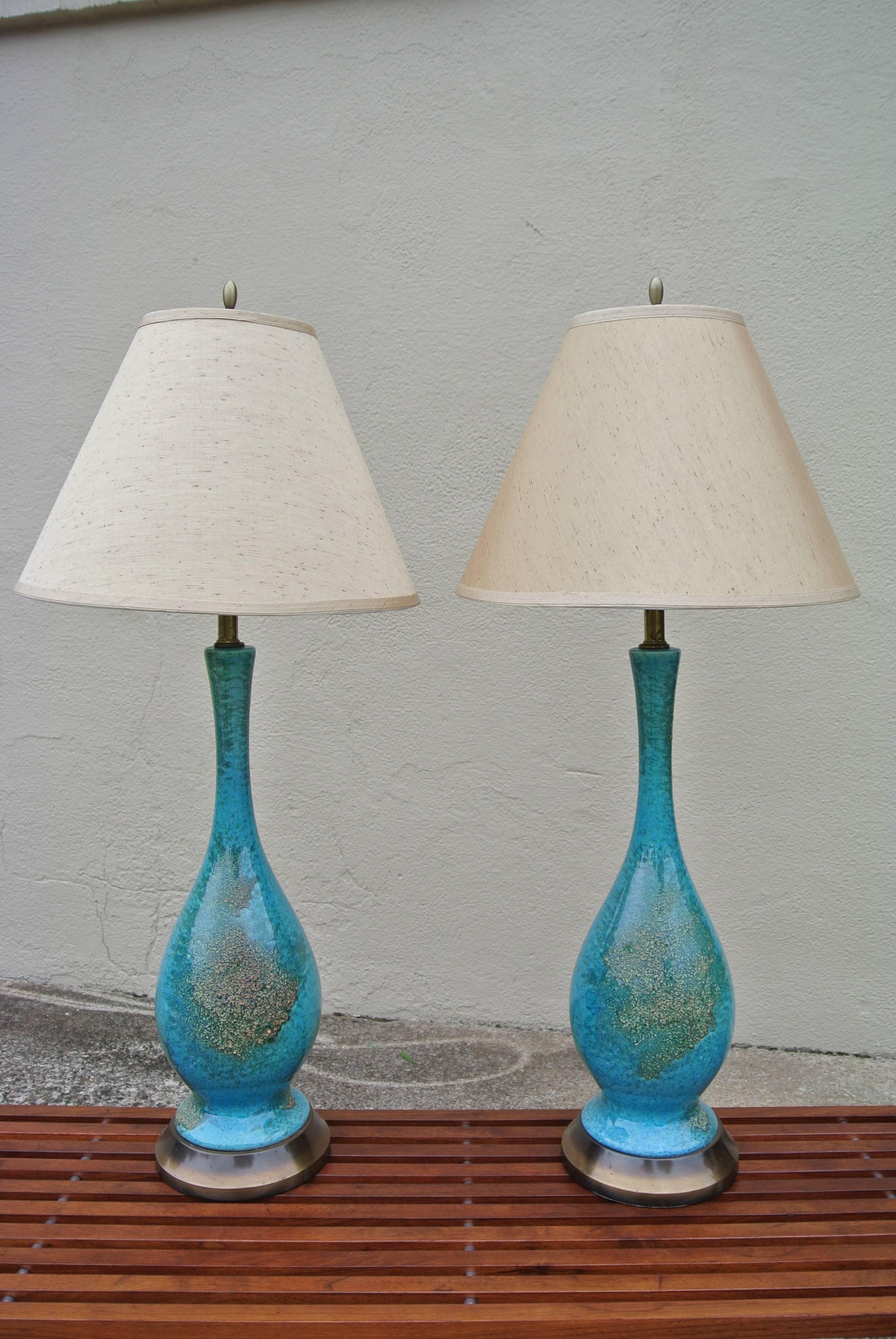 Beautiful pair of Ceramic glazed lamps with silk shades.