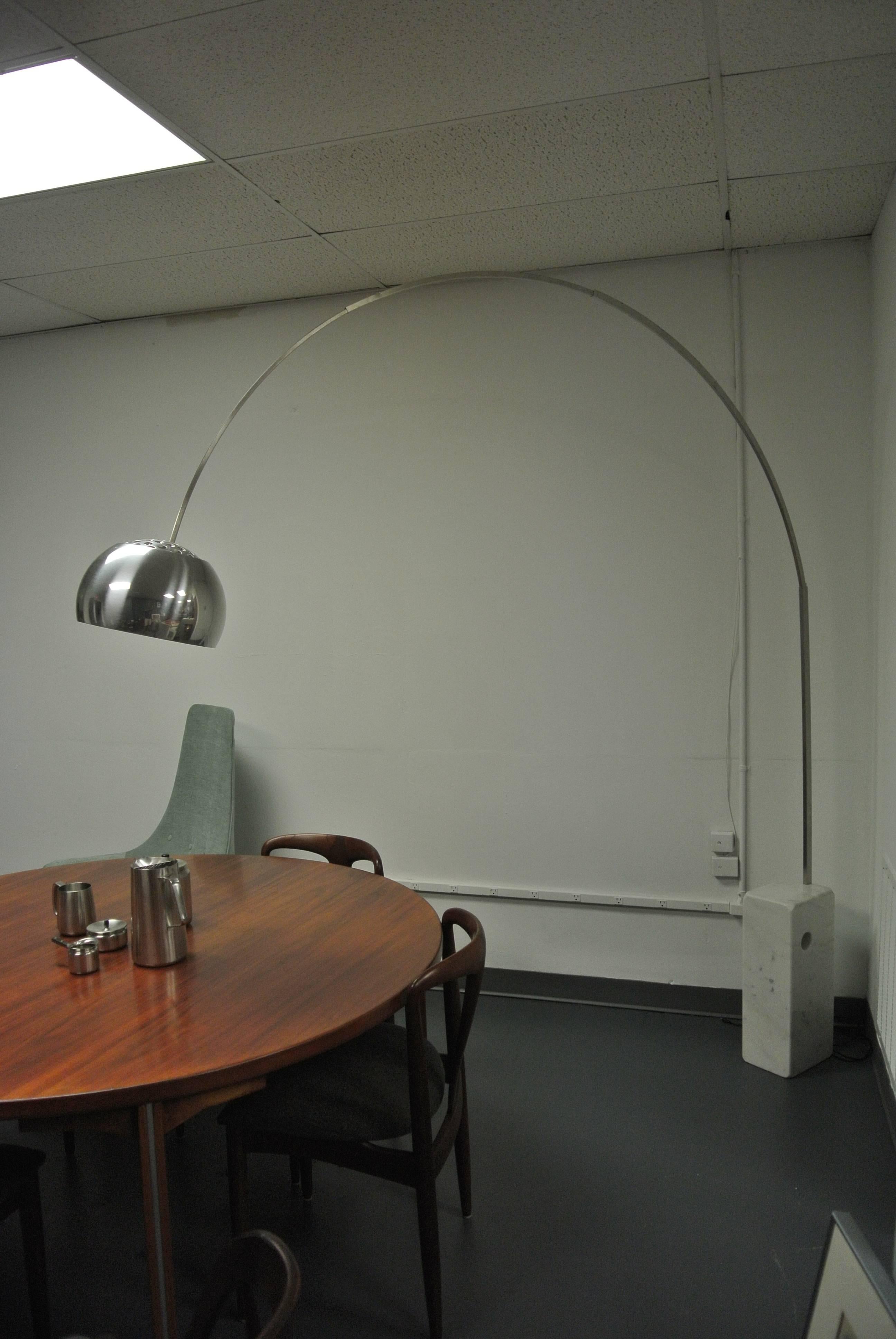Achille Castiglioni designed Arco floor lamp by Flos. Features LED flat panel bulb with floor dimmer.