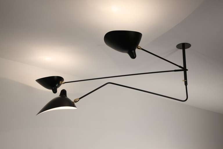 Licensed edition from Serge Mouille’s original design.
Pre-curser of the ceiling three arms, the ceiling two fixed arms with one curved and rotating arms has seen a great regain of interest.
