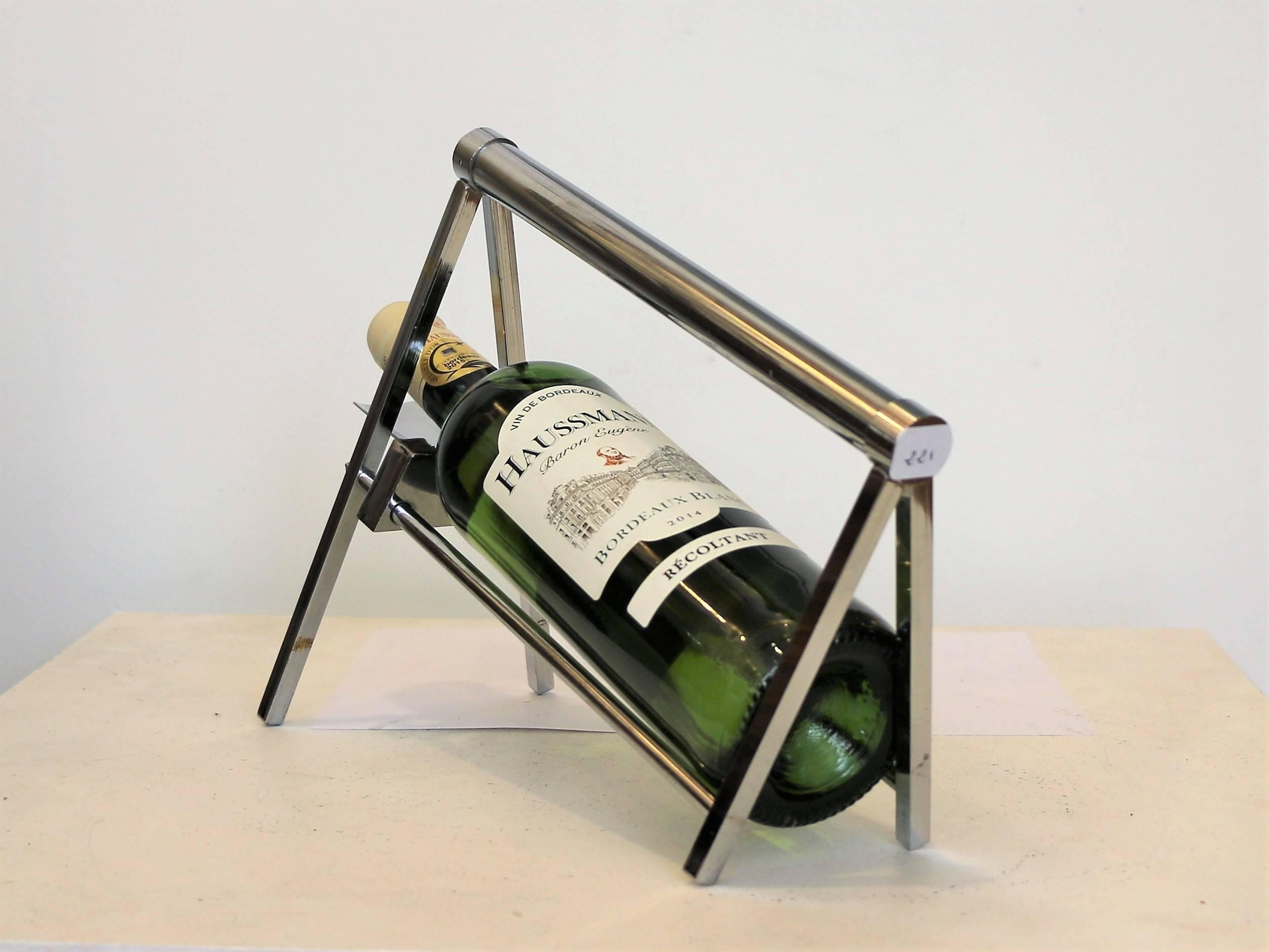 Iconic bottle carrier by Jacques Adnet (1900-1984). Chromium plated metal. Typiccal modernist style from 1930-1940.