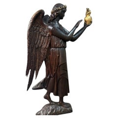 A large English oak relief carving of an angel, early 20th century