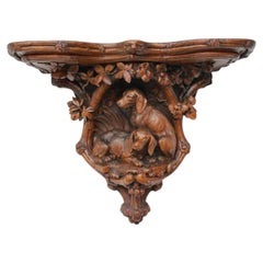 A Black Forest Carved Linden Wood Canine Wall Bracket Swiss, Late 19th Century