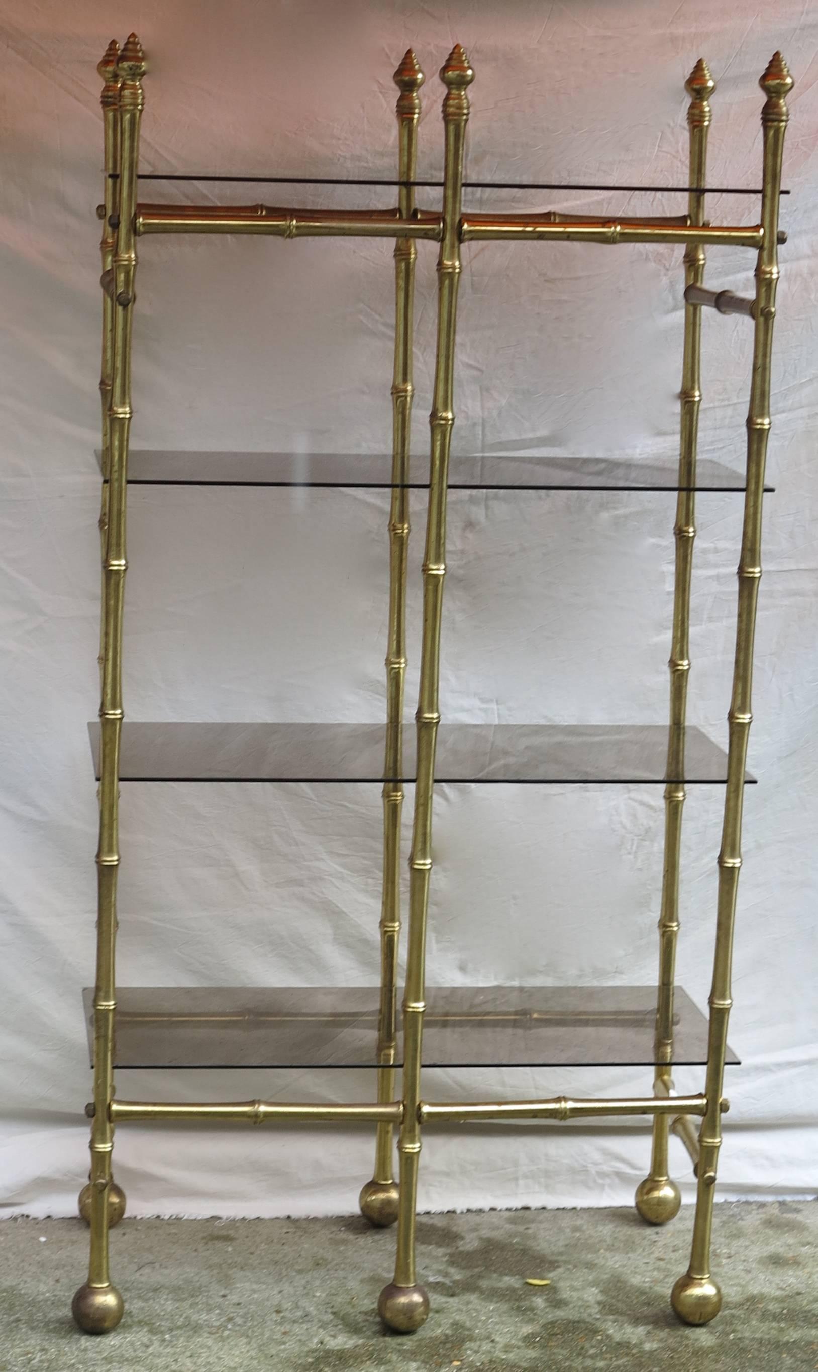 Shelf with four golden brass trays in smoked glass, screw and bolt
circa 1970, in good condition.