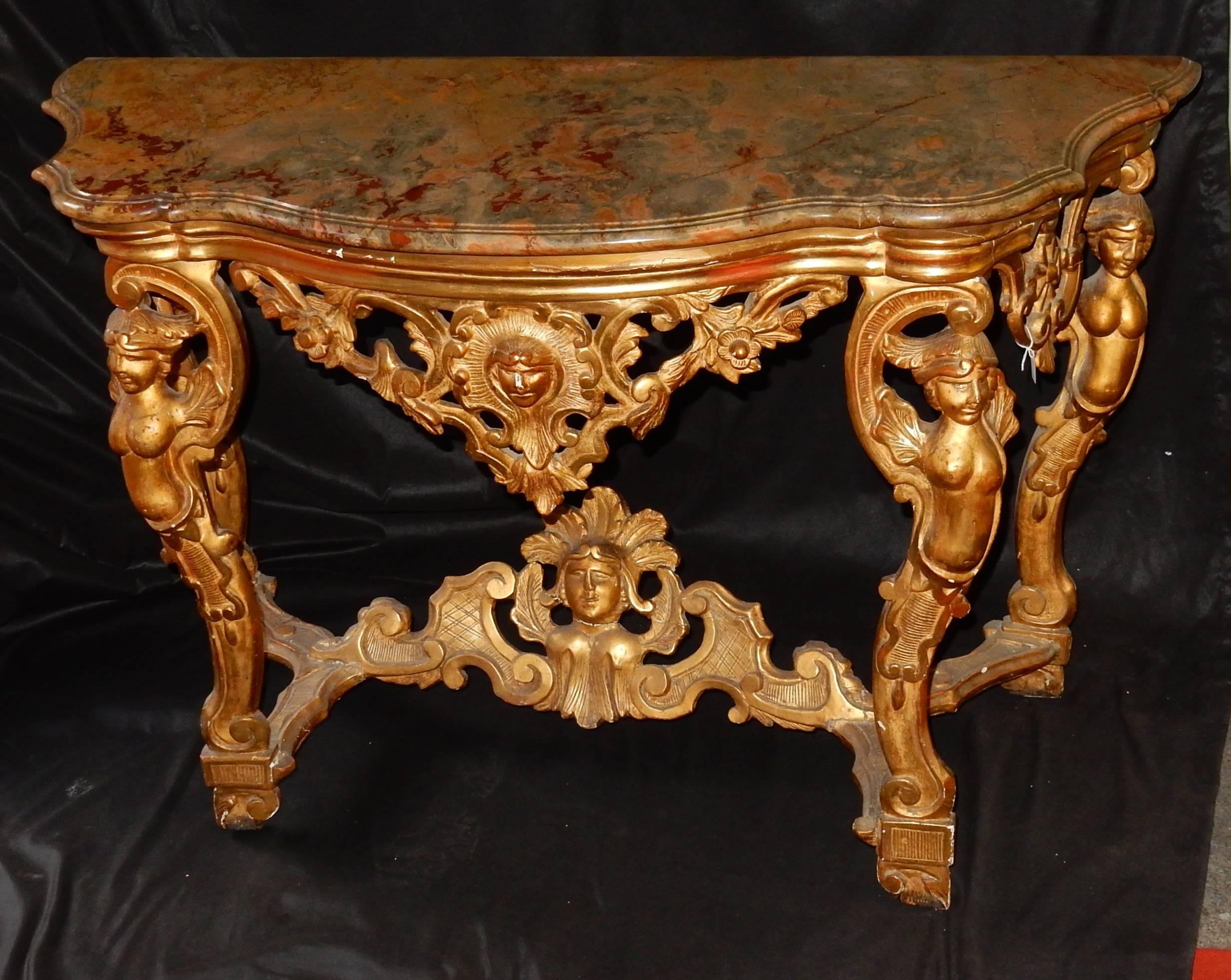 Italian console four feet with characters trains arbaléte, marble with beak corbin, gilt with gold, condition of use, plan a restoration.