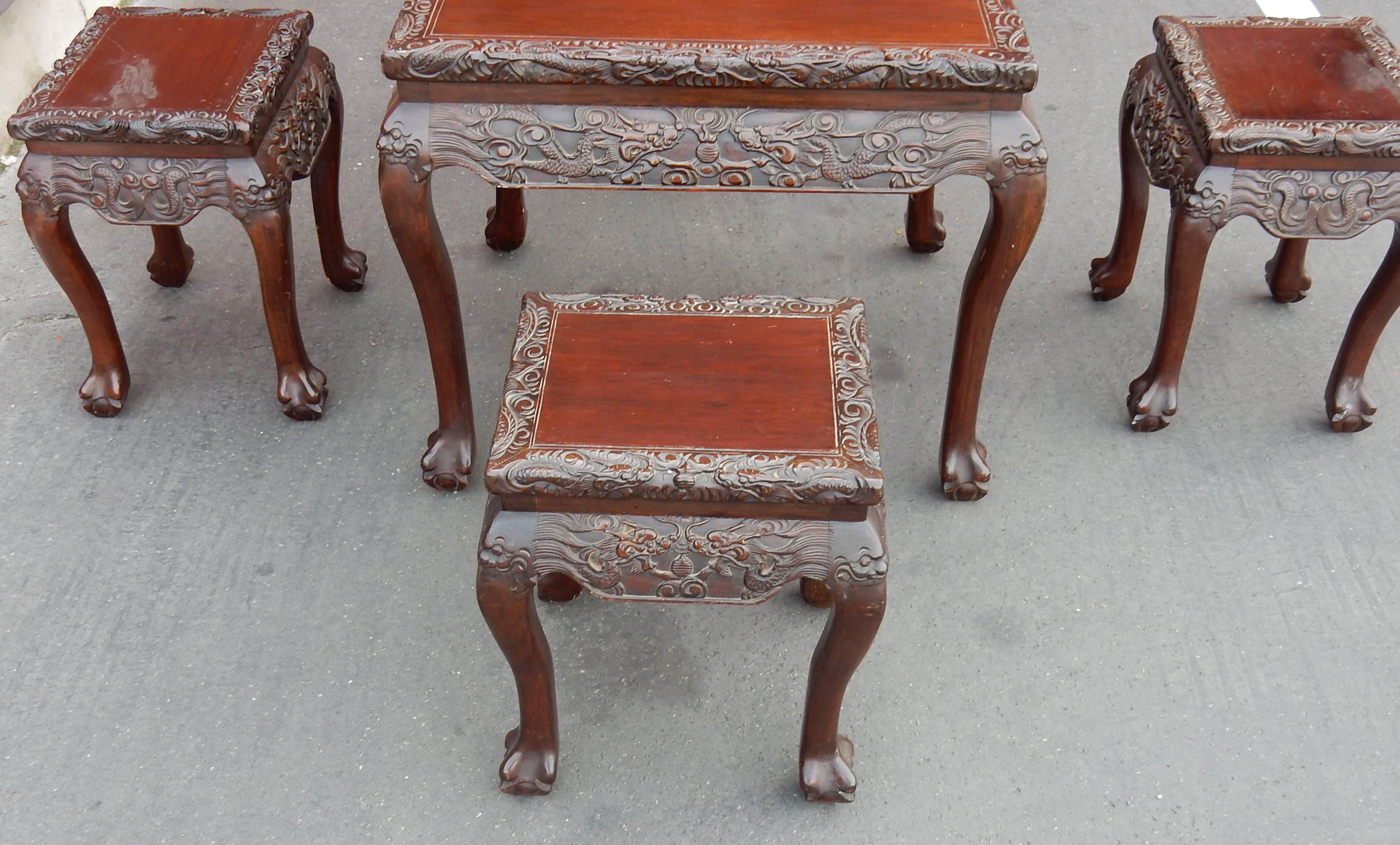 Table has at the middle height with its four stools which can skip below and serve also as side tables,
Rosewood, size of stools: 39 x 34 H 46 cm, good condition, circa 1920-1950.