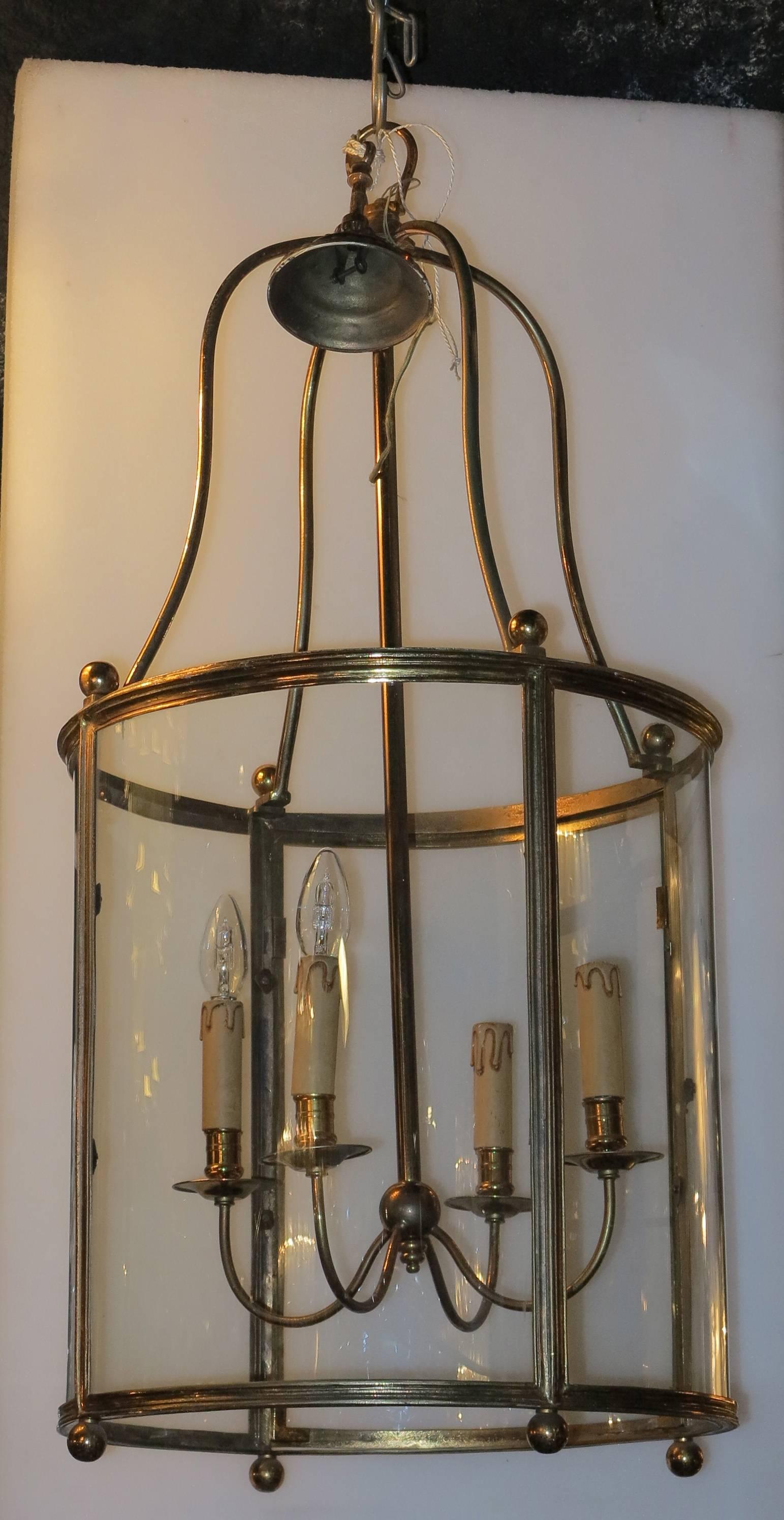 Three lanterns, height without the chain 91 cm, four lamps, circa on 1950-1970, good condition, four rounded glasses, height of the cylinder 48 cm, everything is screw.
