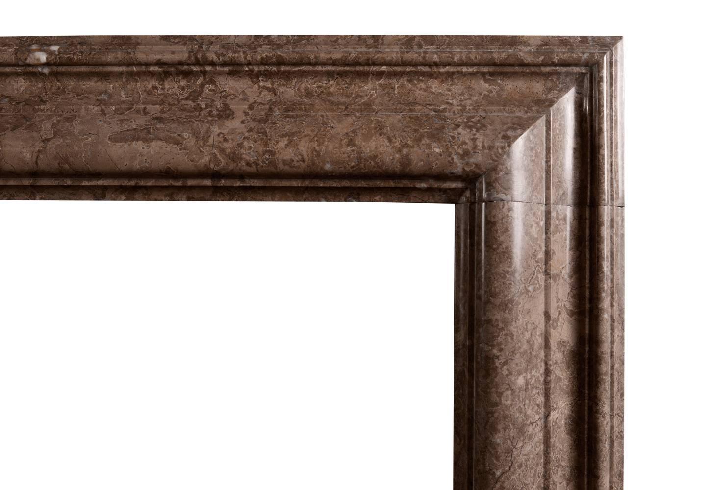 A moulded bolection fireplace in brown / beige Napoleon Mouchette marble. English. Modern.

Shelf Width:	1430 mm      	56 1/4 in
Overall Height:	1105 mm      	43 1/2 in
Opening Height:	935 mm      	36 3/4 in
Opening Width:	1100 mm      	43 1/4