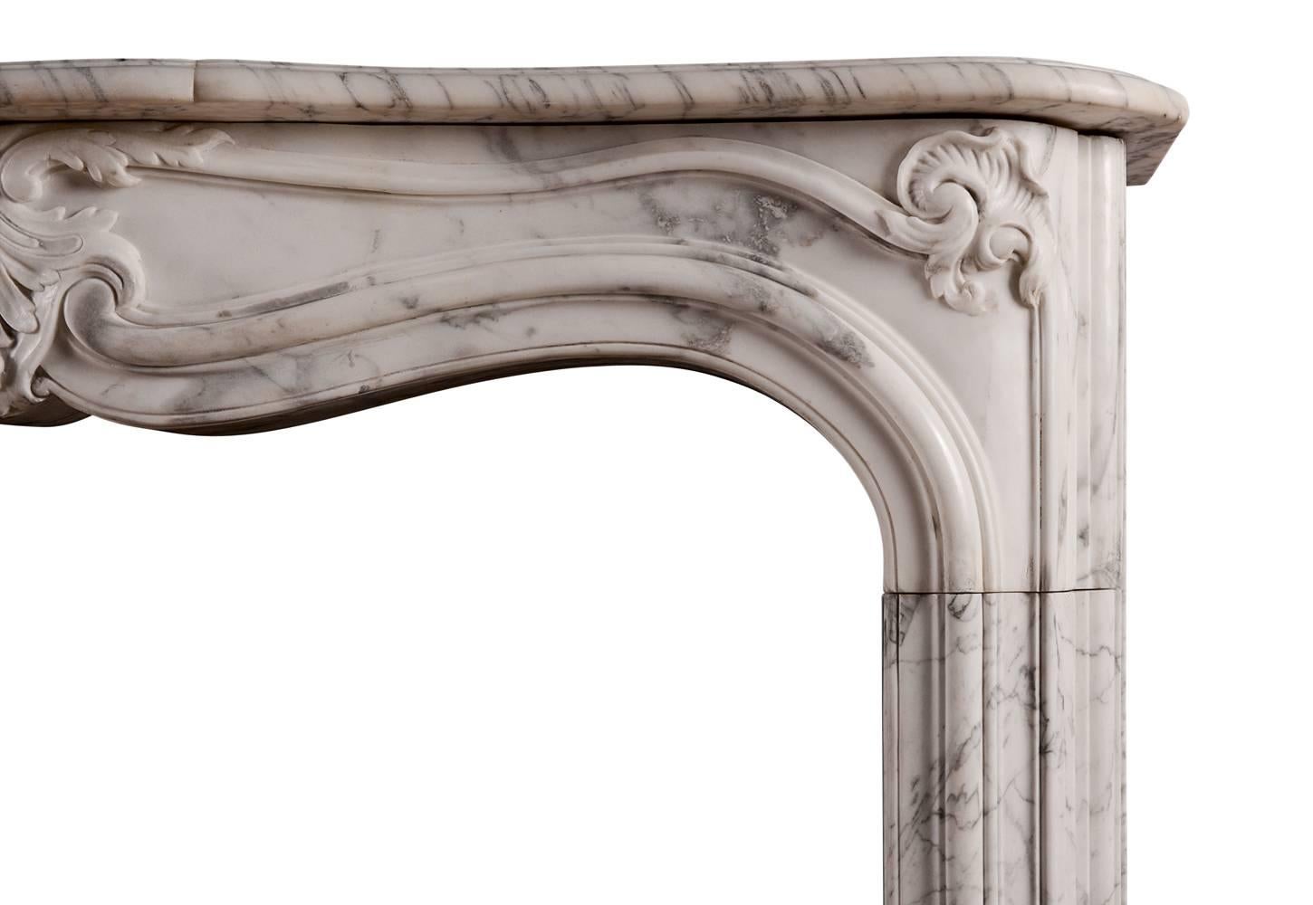 A good quality Rococo Louis XV fireplace in Italian Arabescato marble. The elegantly shaped frieze with panels and carved foliage to centre and interesting mouldings to jambs. Shaped, moulded shelf above, French, 19th century.

Shelf width - 1450 mm