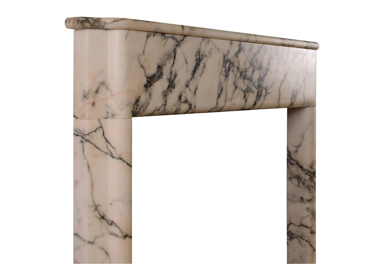 A rarely found English, early 20th century Art Deco fireplace in Italian Pavonazzo marble. The moulded jambs surmounted by plain frieze and shaped shelf above.

Measurements:
Shelf width - 1360 mm / 53 1/2 in.
Overall height - 1310 mm / 51 5/8