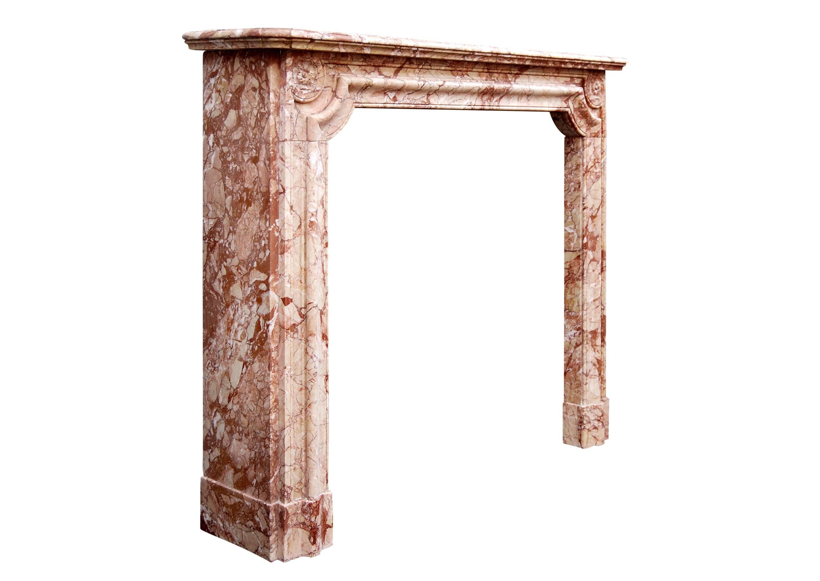 A 19th century French Napoleon III (circa 1870) Breccia Pernice marble fireplace. The moulded frieze and jambs and carved round pateraes to end.

Measures: Shelf width 1314 mm 51 ¾ in
Overall height 1092 mm 43 in
Opening height 940 mm 37