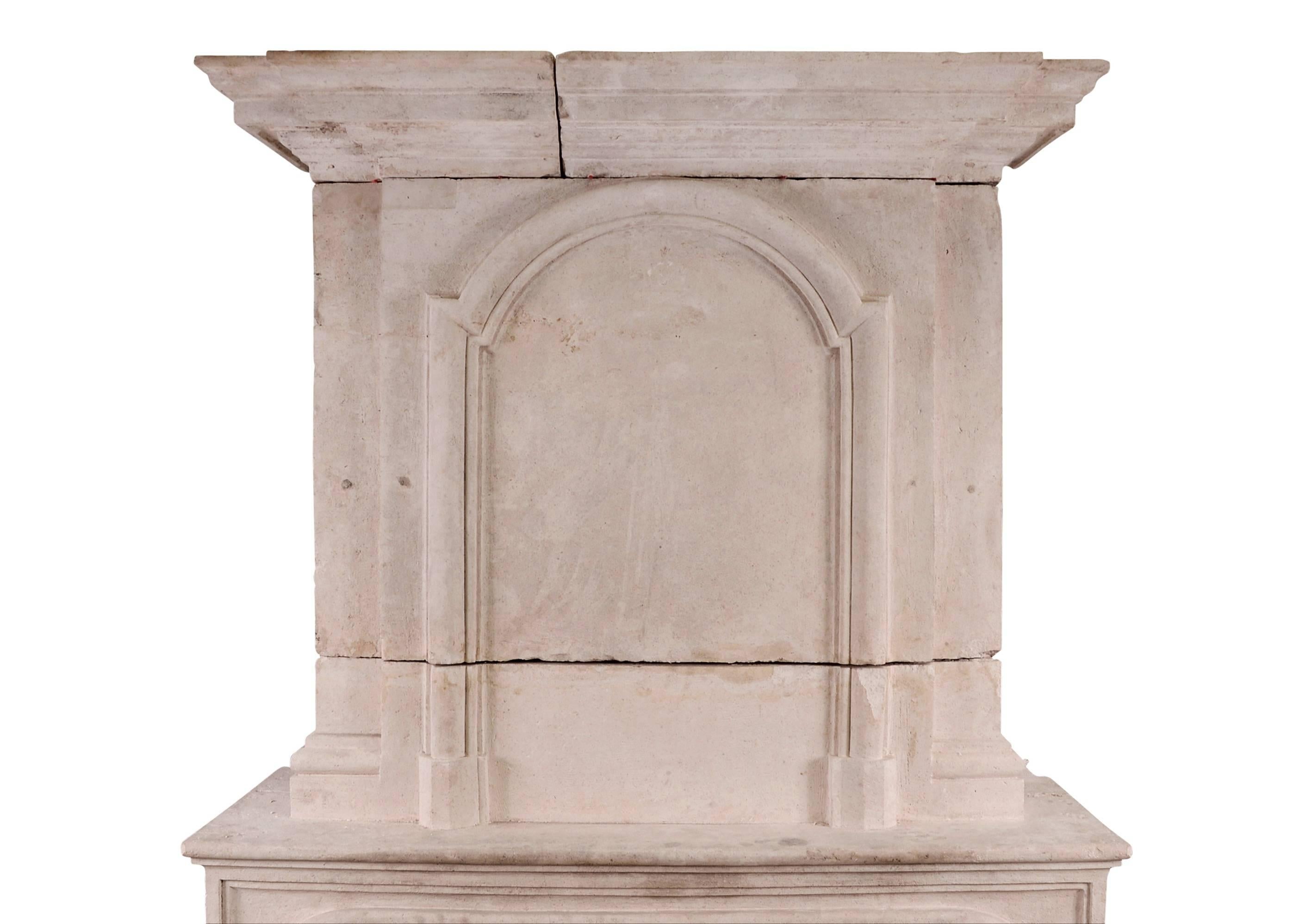 French Early 18th Century Louis XIV Limestone Fireplace with Pannelled Trumeau