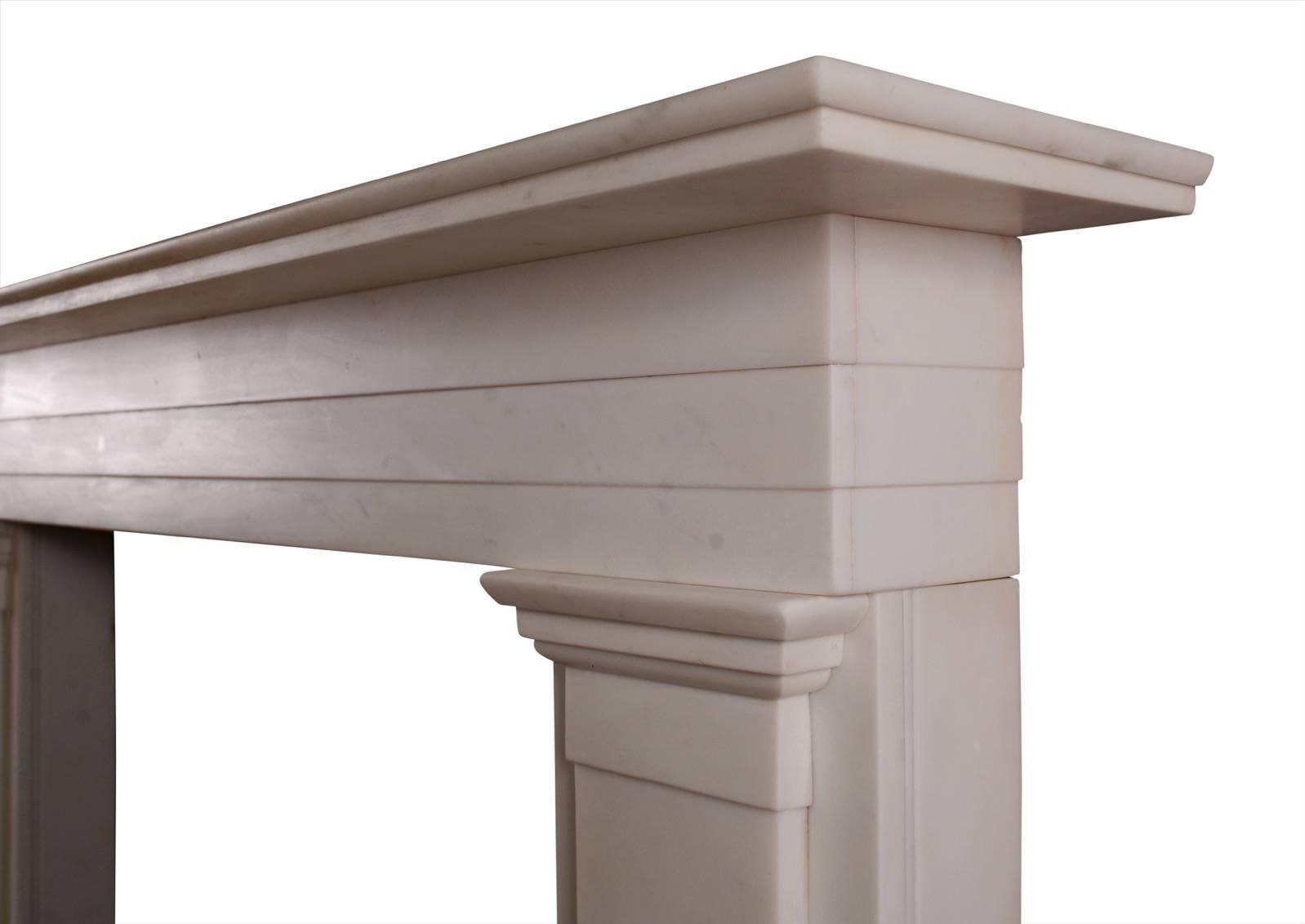 A substantial Regency Statuary white marble fireplace. The jambs surmounted by moulded capitals and tiered frieze. Large plain shelf above, English, early 19th century. One of an exact pair. Very good quality statuary marble.

Measurement:
Shelf