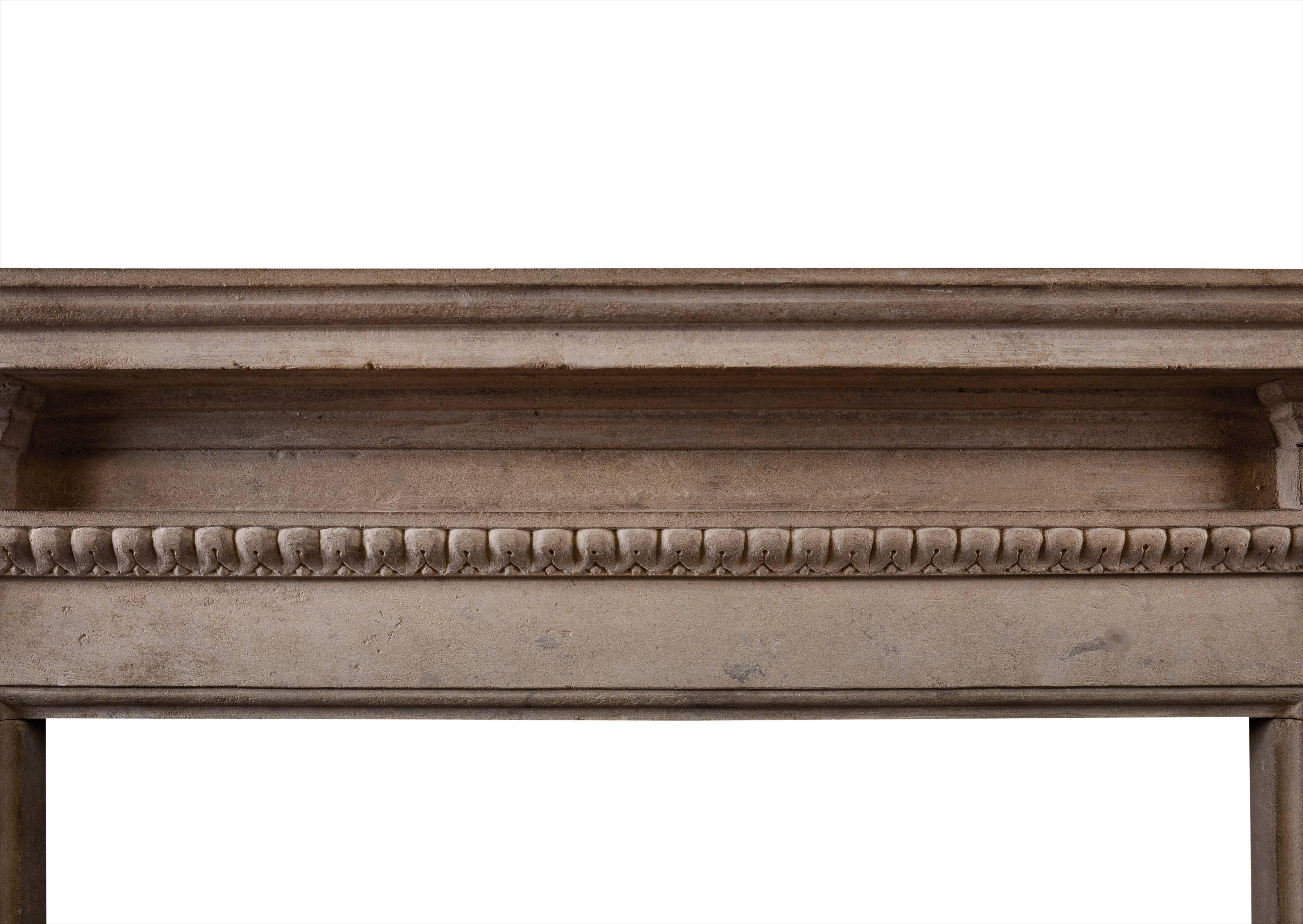 A rustic Georgian style Bath stone fireplace of architectural form. The carved jambs with acanthus leaf mouldings and carved rosette paterae. Moulded shelf above. English. Nice quality patina to stone.

Measures: 
Shelf width: 1615 mm / 63 5/8