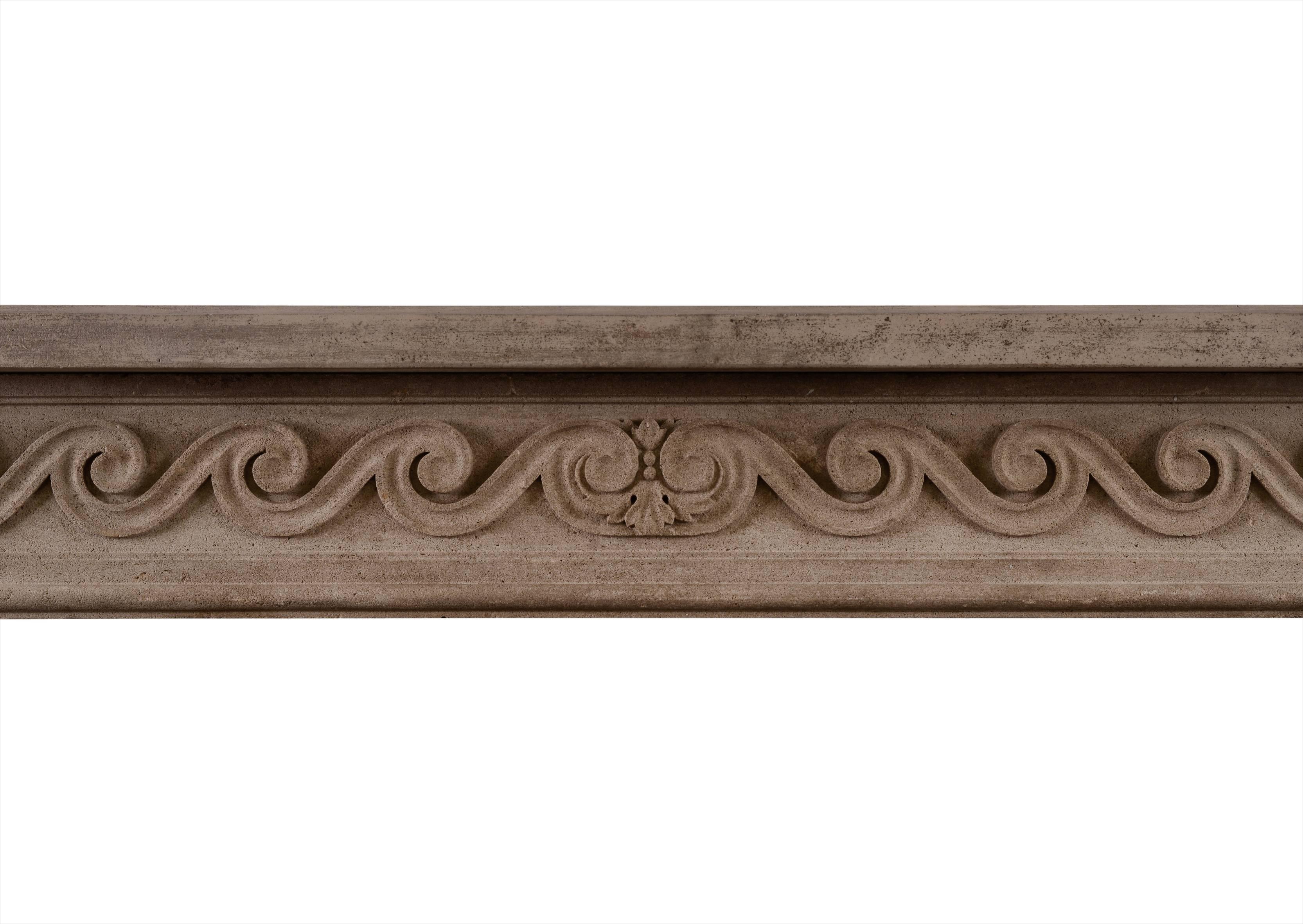 A good quality French Louis XVI style limestone fireplace. The shaped, stop-fluted jambs surmounted by carved square paterae. The frieze with carved handed C-scroll surmounted by breakfront shelf. 19th century.

Measures: 
Shelf width: 1455 mm / 57