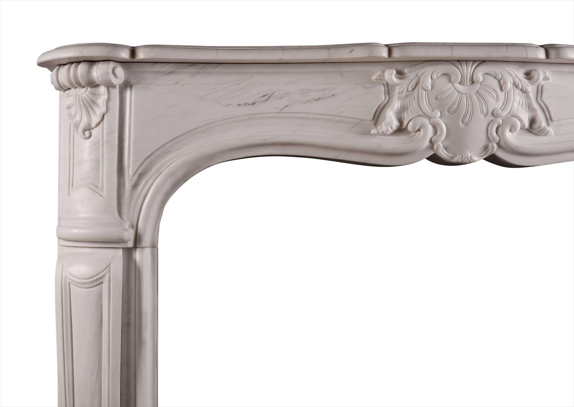A French Louis XV style fireplace in white marble. The shaped, panelled jambs surmounted by frieze with carved shell and scrolls. Shaped shelf. Modern.

Measures: Shelf width 1524 mm 60 in
Overall height 1127 mm 44 ? in
Opening height 937 mm 36