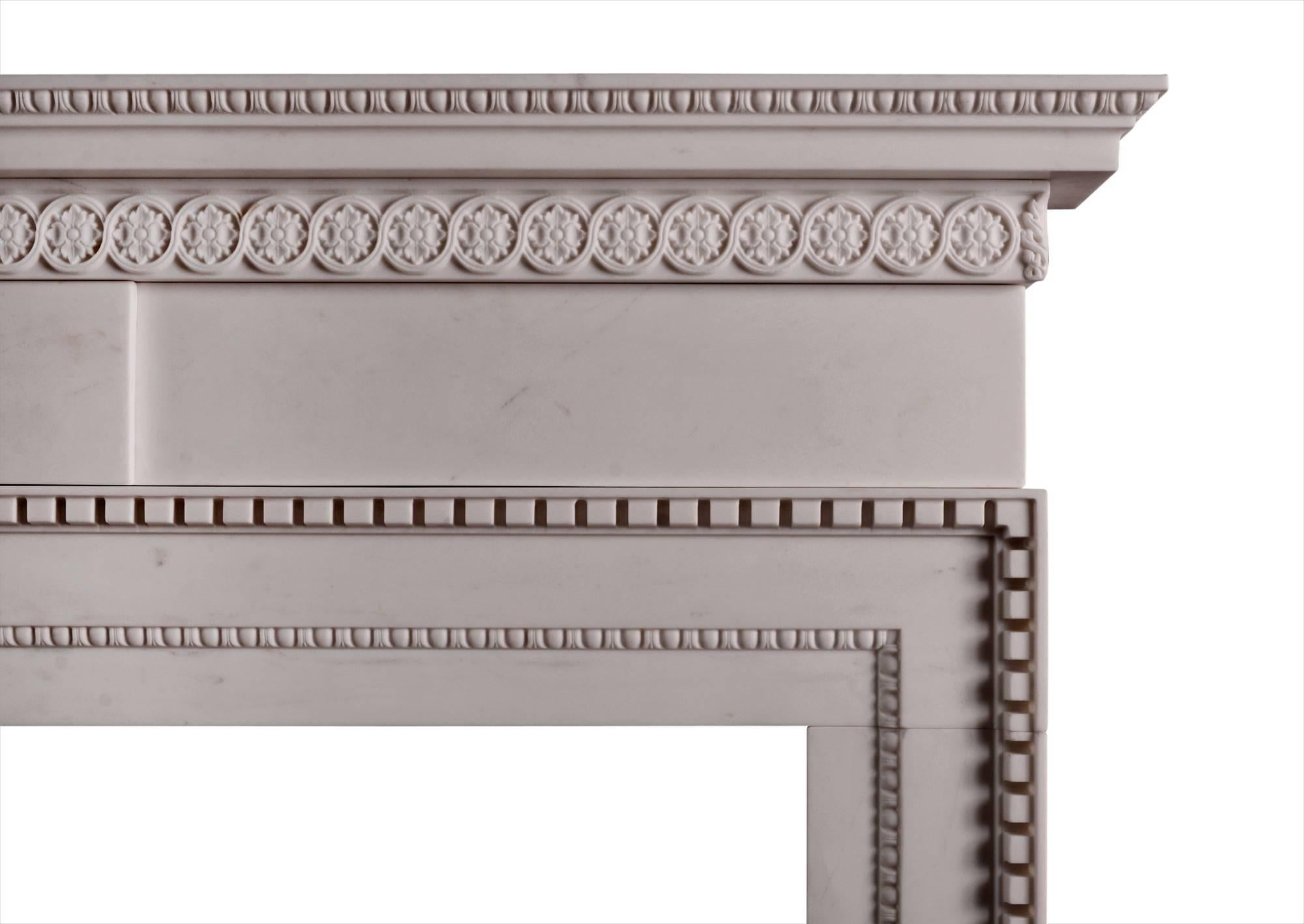 A fine quality English, white marble fireplace in the mid Georgian style. The frieze with plain centre tablet, the jambs with delicate inner moulding of egg-and-dart and carved acanthus leaves to corners. The shelf with carved rosette pattern