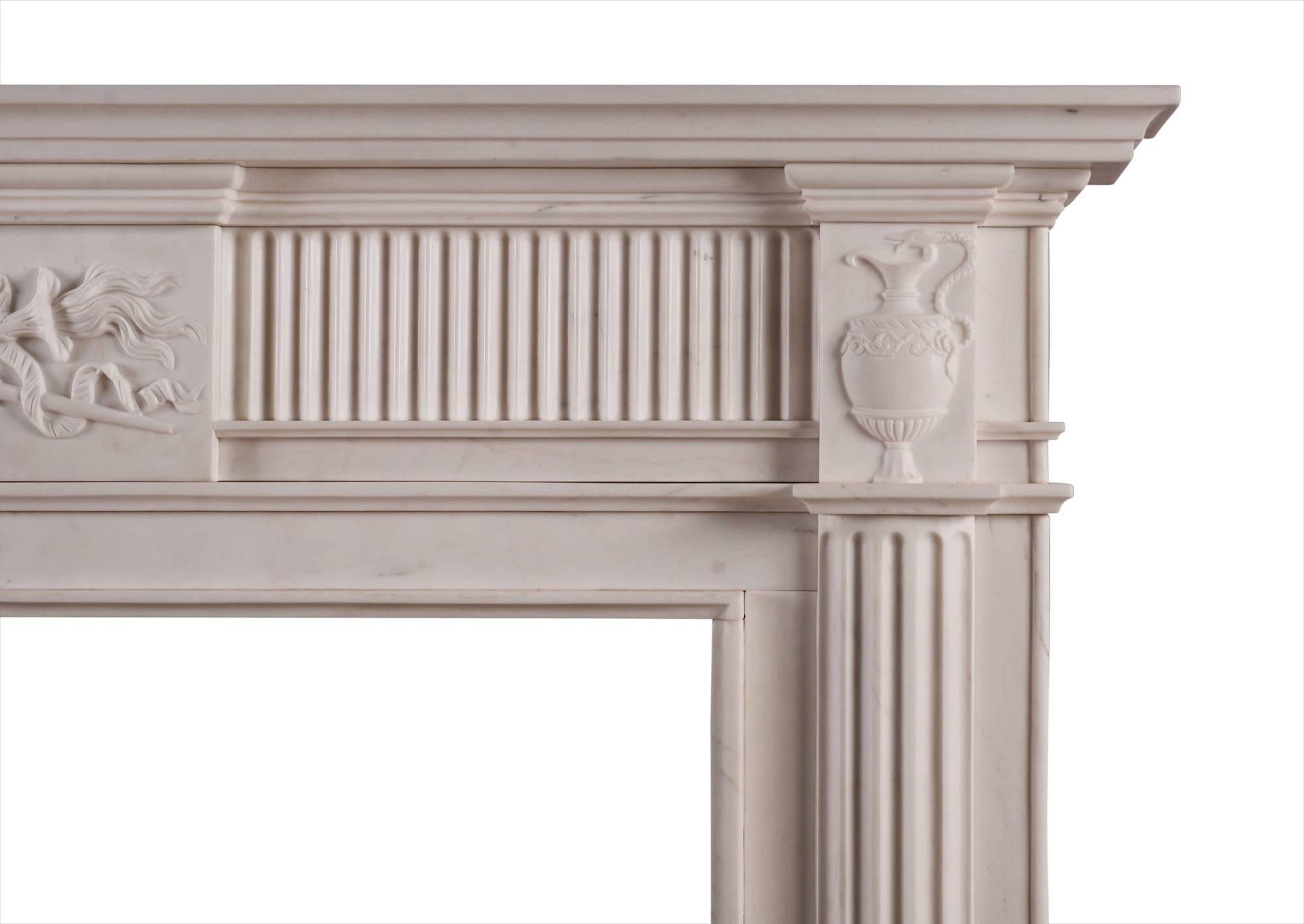 A well-proportioned English Georgian style fireplace. The fluted frieze with centre block of the carved centre of winged staff and flamed torch, intertwined with ribbons and serpent. The end blockings of classical Grecian urns, with egg and dart