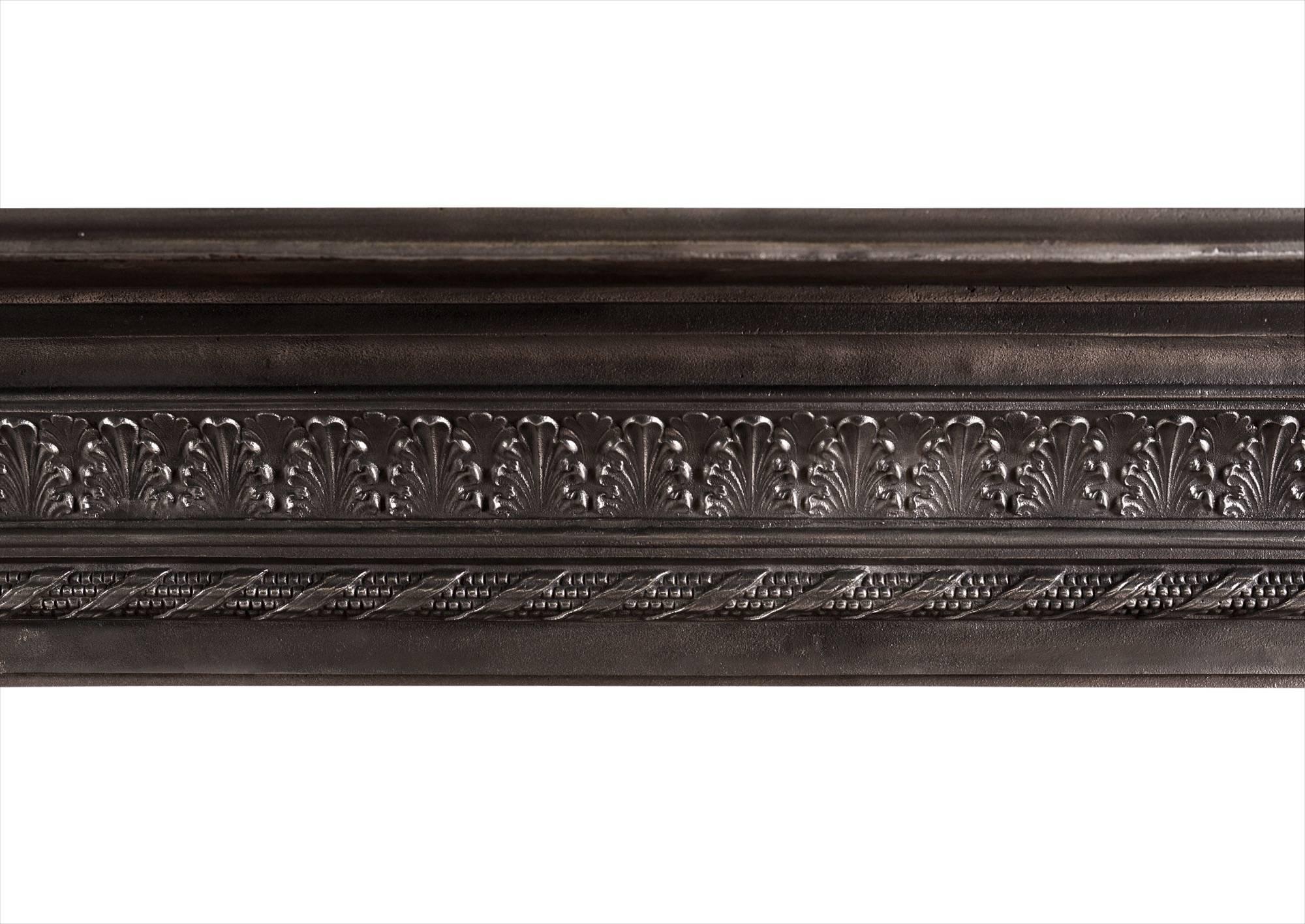 An attractive mid-19th century English cast iron fireplace. The frieze with acanthus leaf detailing, the jambs with scrolled brackets and rope mouldings to inner and outer edges.

Measures:
Shelf Width:	1650 mm      	65 in
Overall Height:	1185 mm   