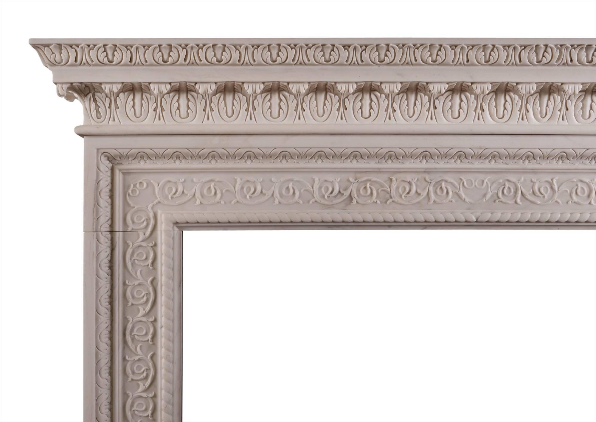 A mid-Georgian style fireplace carved in white marble. Scrolled leaf motif to frieze and jambs with rope moulding, the shelf with scrolled acanthus leaves and intricate moulding above. In the Palladian style associated with architects such as Inigo