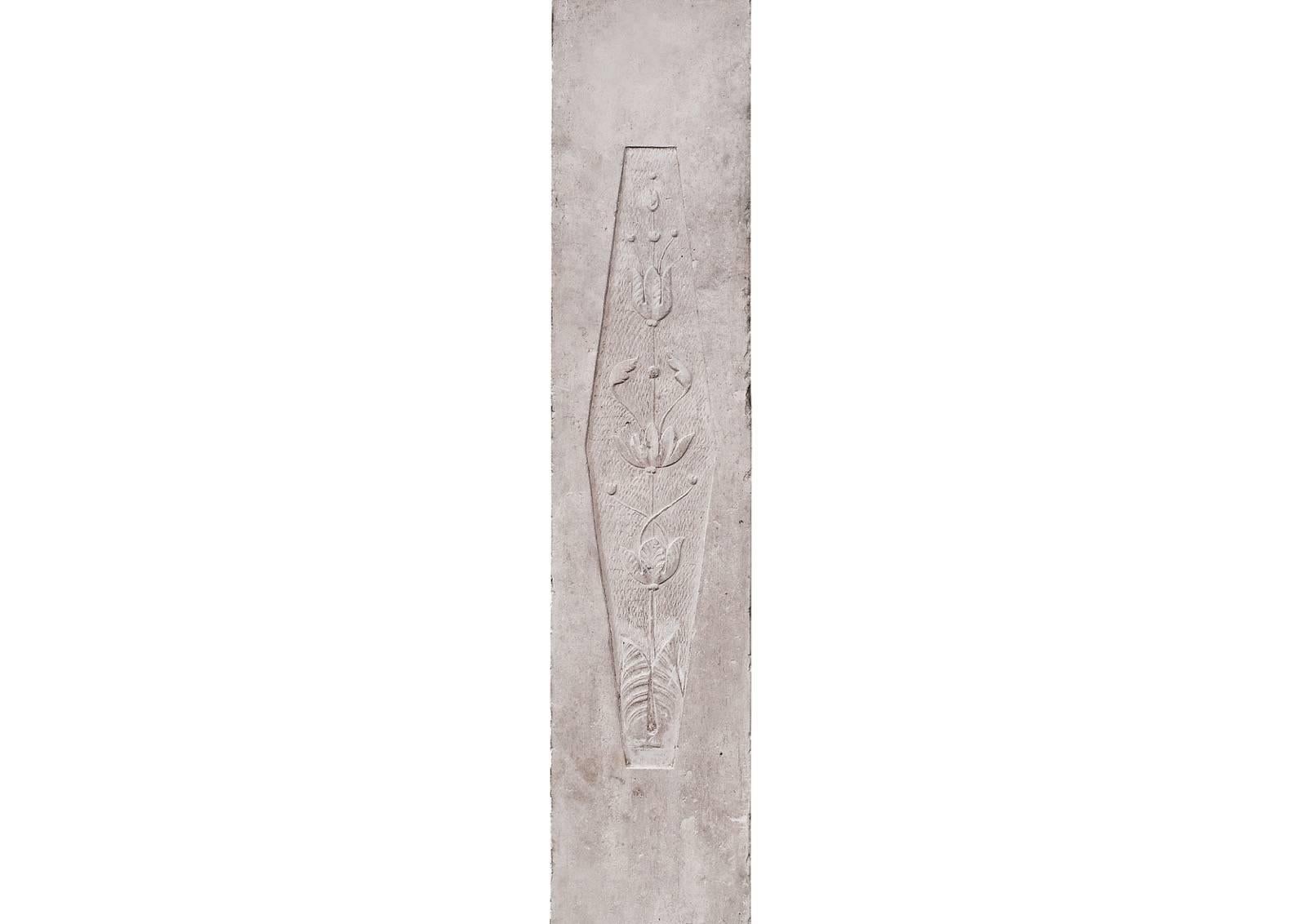 A very finely carved French Louis XVI limestone fireplace. The delicately carved frieze with diamond centre motif of rosette and husks, the jambs with leaves and foliage surmounted by carved round paterae. Directoire period with an Egyptian