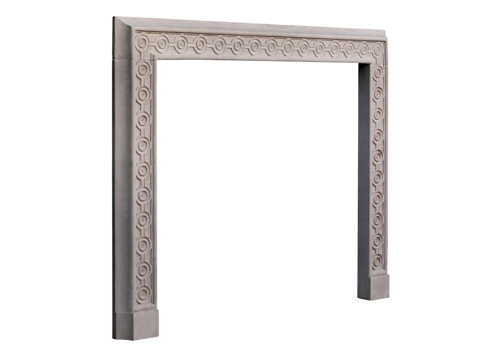 An attractive English limestone fireplace. The frieze and jambs with guilloche carving and scotia moulding to outside. A Fine architectural piece. Modern.

Measures: 
Shelf width:          1435 mm /    56 1/2 in
Overall height:     1175 mm /     46