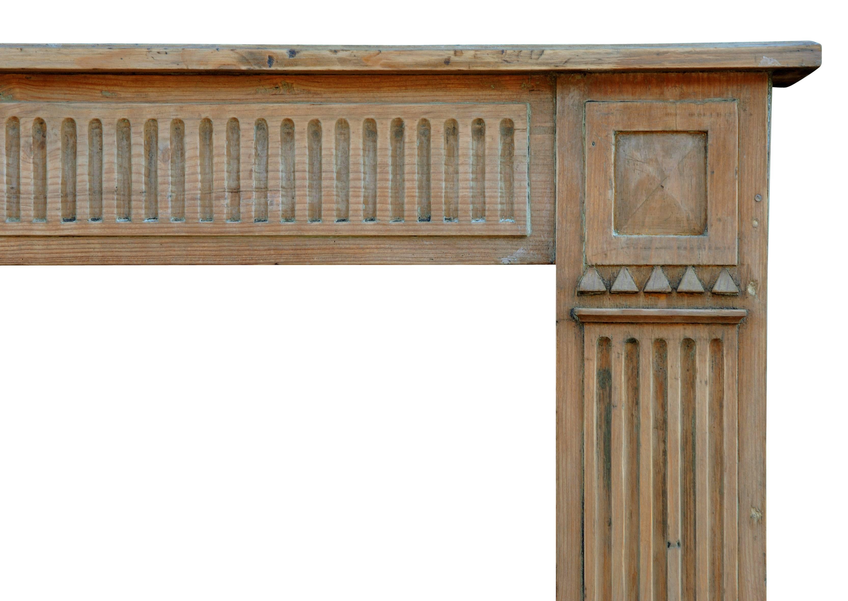 A late 18th century, French, Louis XVI pine fireplace, with fluted frieze and jambs.

Measures: Shelf width - 1537 mm 60 ½ in.
Overall height - 1118 mm 44 in.
Opening height - 933 mm 36 ¾ in.
Opening width - 1111 mm 43 ¾ in.
Depth of shelf -