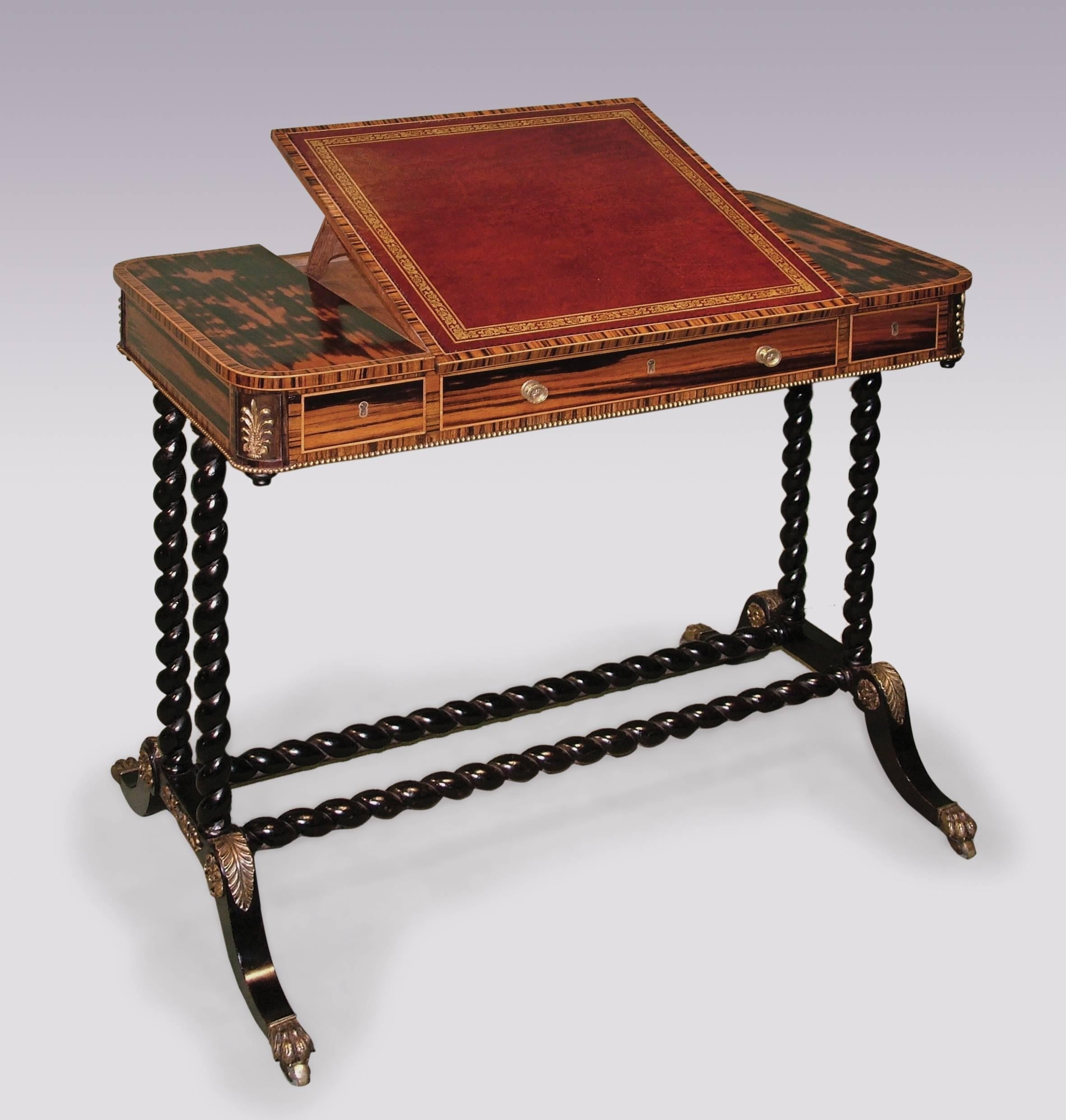An unusual early 19th century Regency period Coromandel wood reading or writing table, boxwood strung throughout, having crossbanded top with central red gilt tooled leather lift up writing surface above beaded frieze with three drawers and applied