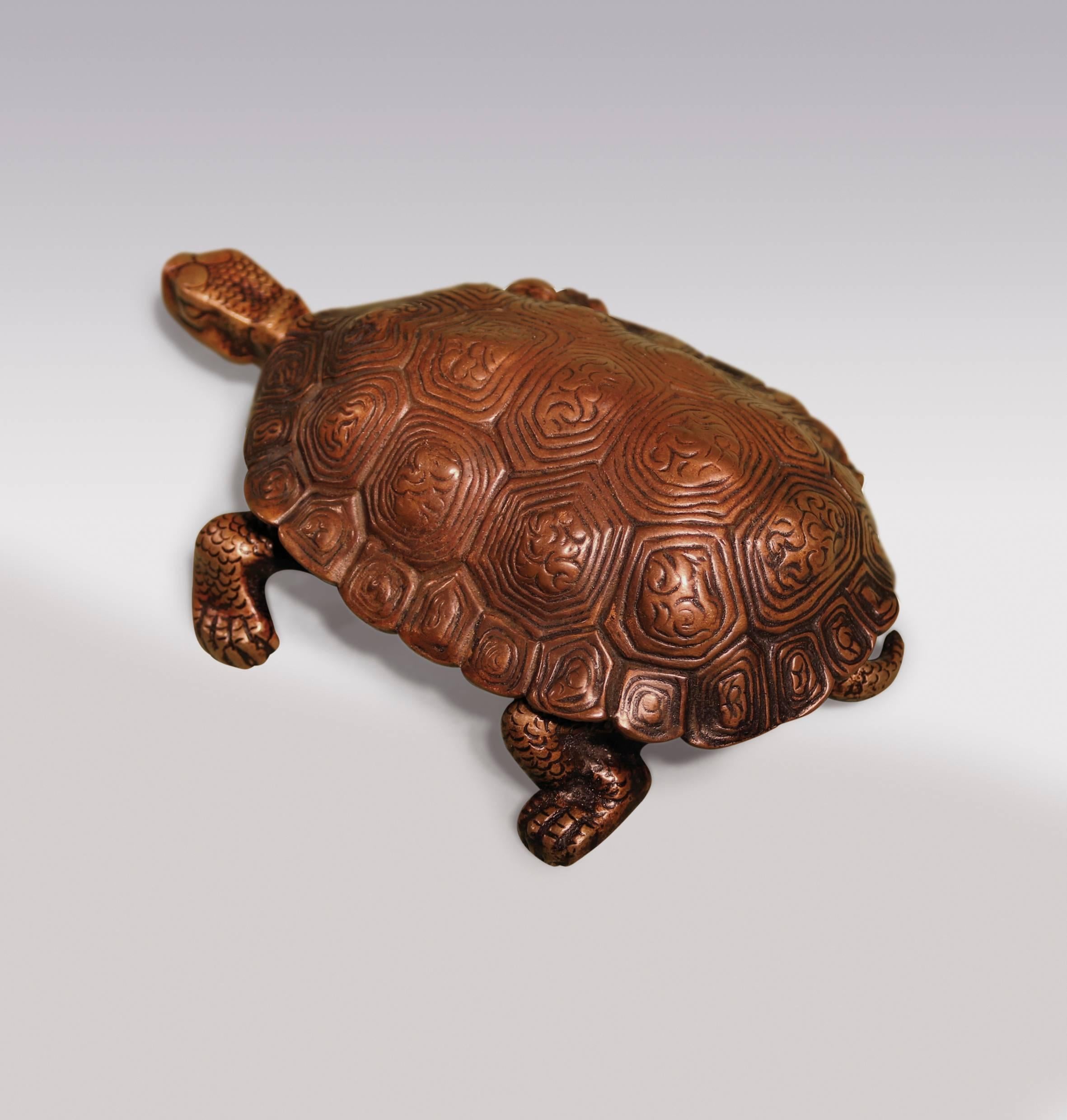 A 19th century well modelled Bronze tortoise having hinged ‘shell’ enclosing two inkwells.
