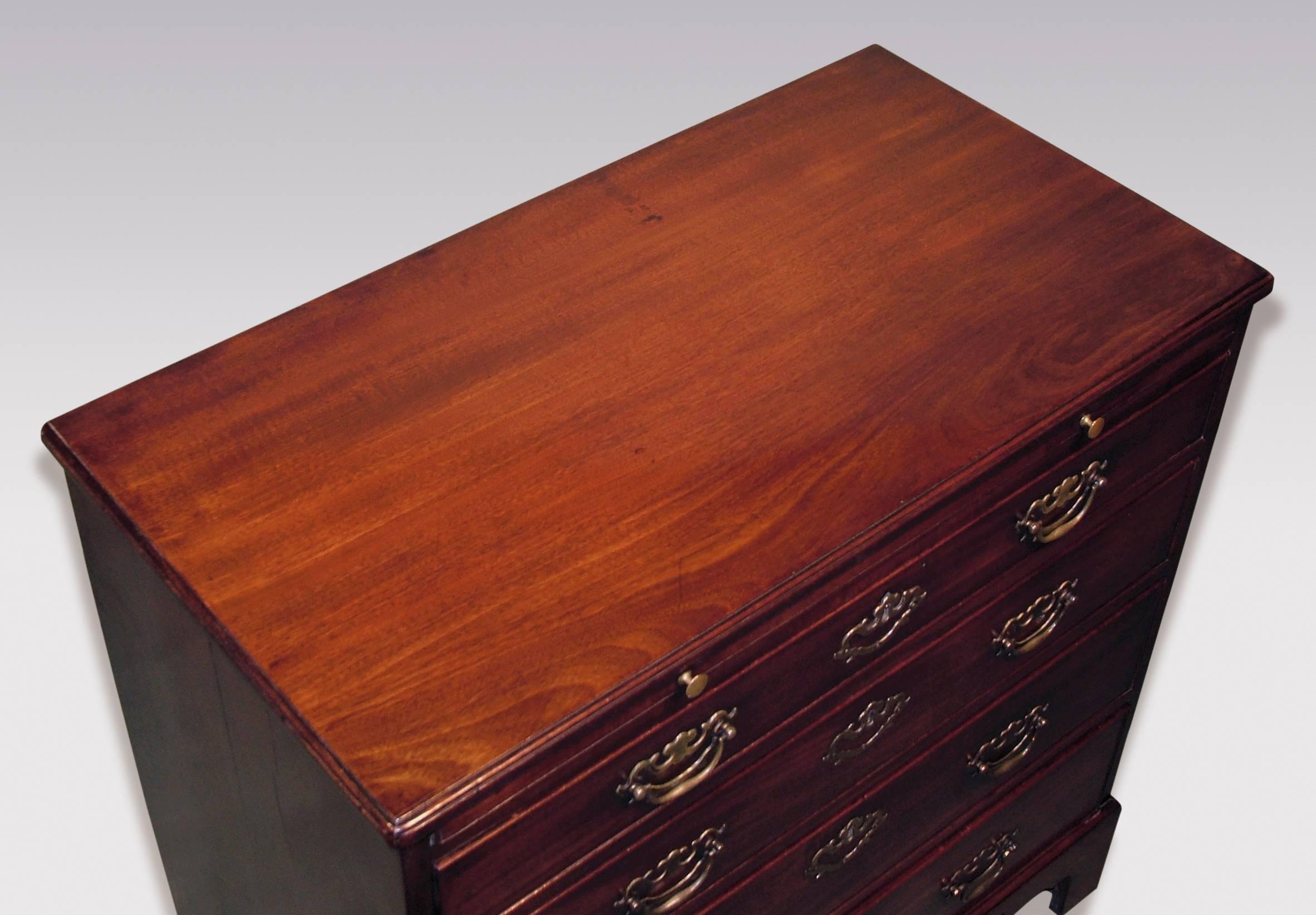 A mid-18th century George III period mahogany straight front Chest, having moulded edge top above brushing slide, fitted with four graduated cockbeaded drawers, retaining original pierced back-plate handles, supported on original bracket feet.