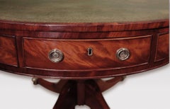 Early 19th century mahogany drum table with green leather revolving top