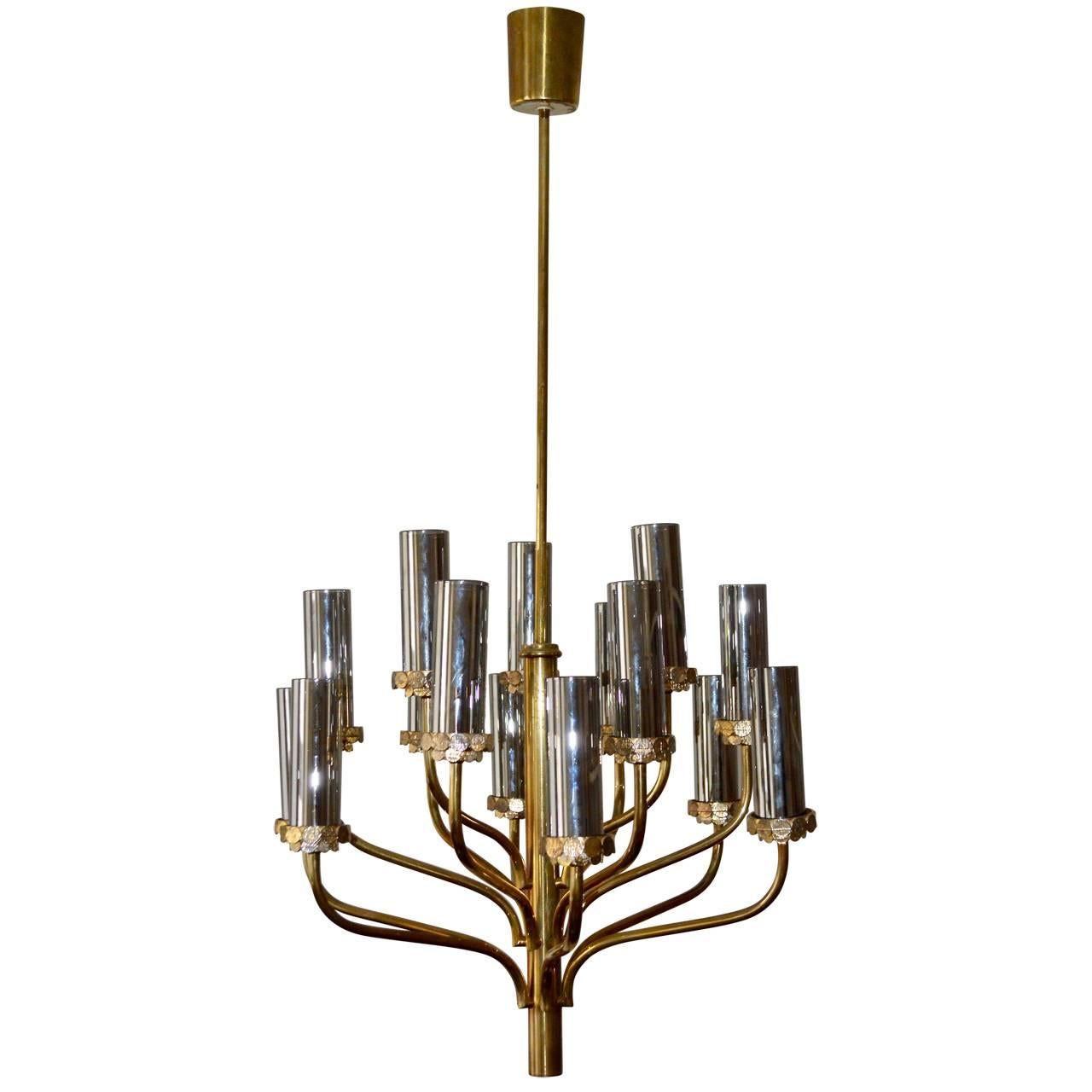 Very beautiful fifteen-light chandelier attributed to Hans Agne Jacobsson. Gives a wonderfull light over the dining table or as sculptural corner light. Very sculptural with or without shades.