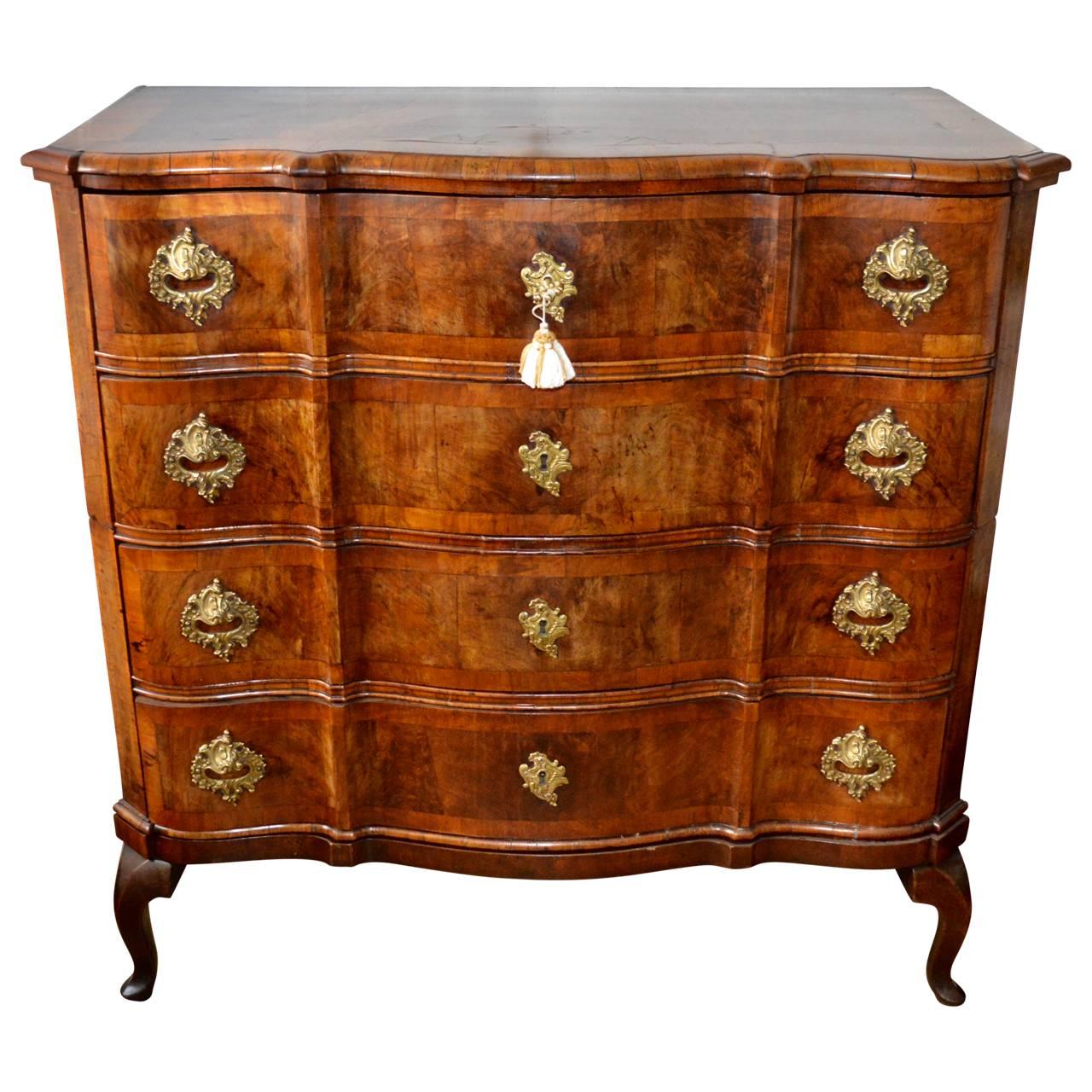 Beautiful Baroque mahogany chest of drawers with four large drawers and bronze hardware, circa 1740-1750, Copenhagen Denmark.
