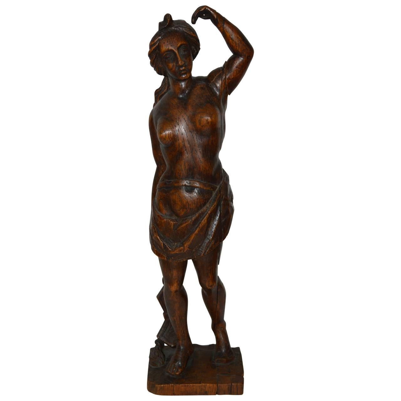 Beautiful carved wood sculpture of a lady.