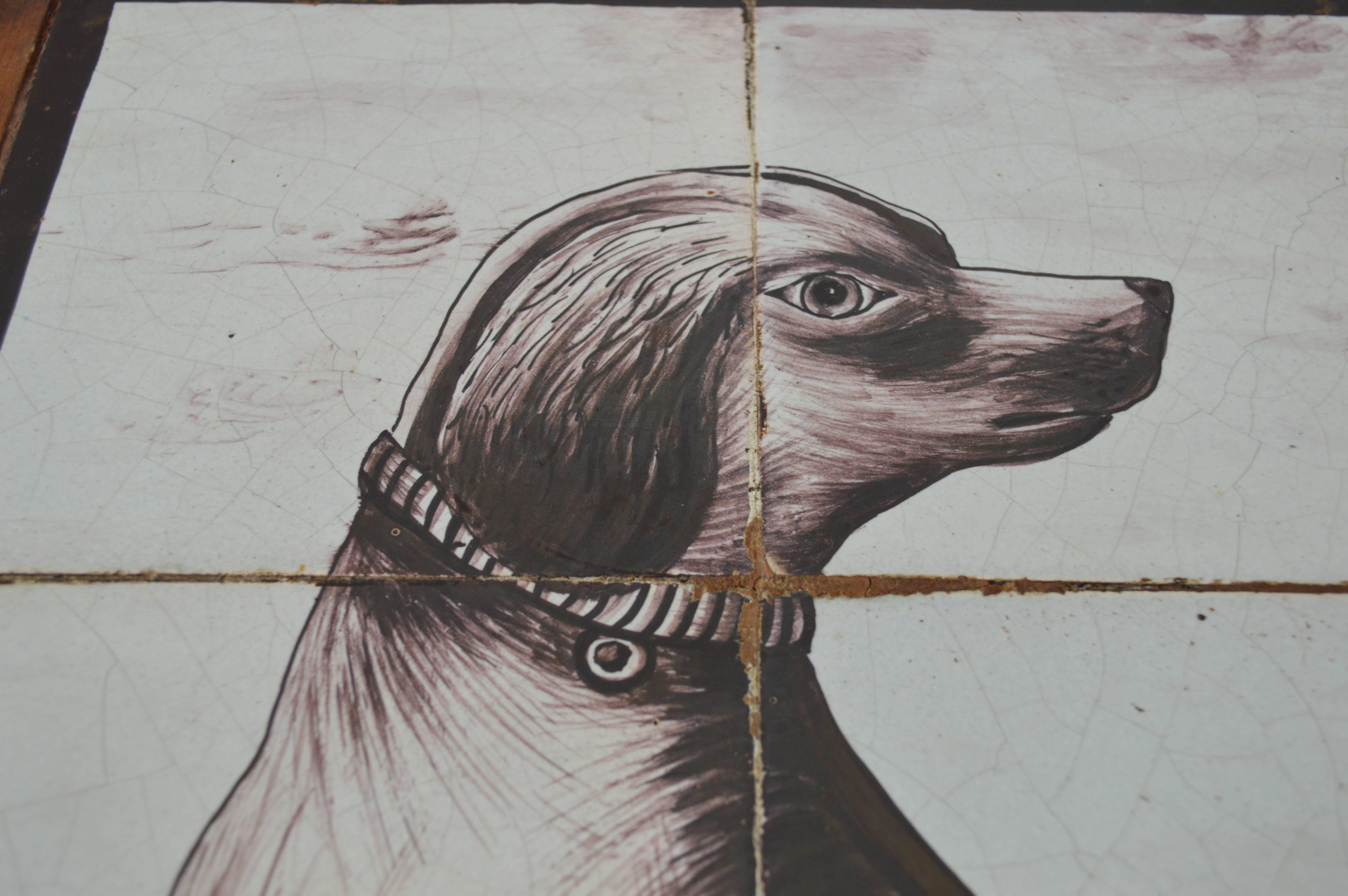 Charming tile panel of a dog in monochrome and very human eyes. These tile pictures, like many Dutch paintings, are telling a story and are possibly betraying the sympathies of the owners.