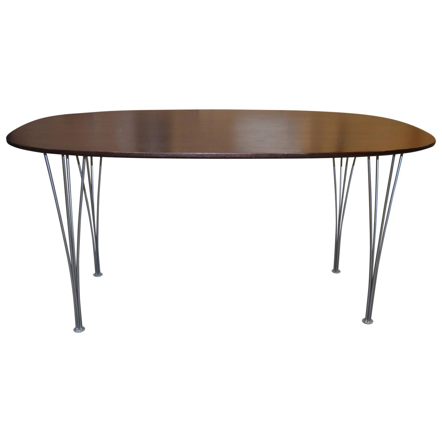 Super Ellipse dining table with chromed steel legs.
Designed by Piet Hein and Bruno Matthsson for Fritz Hansen ,
Denmark 1974 original label to underside.