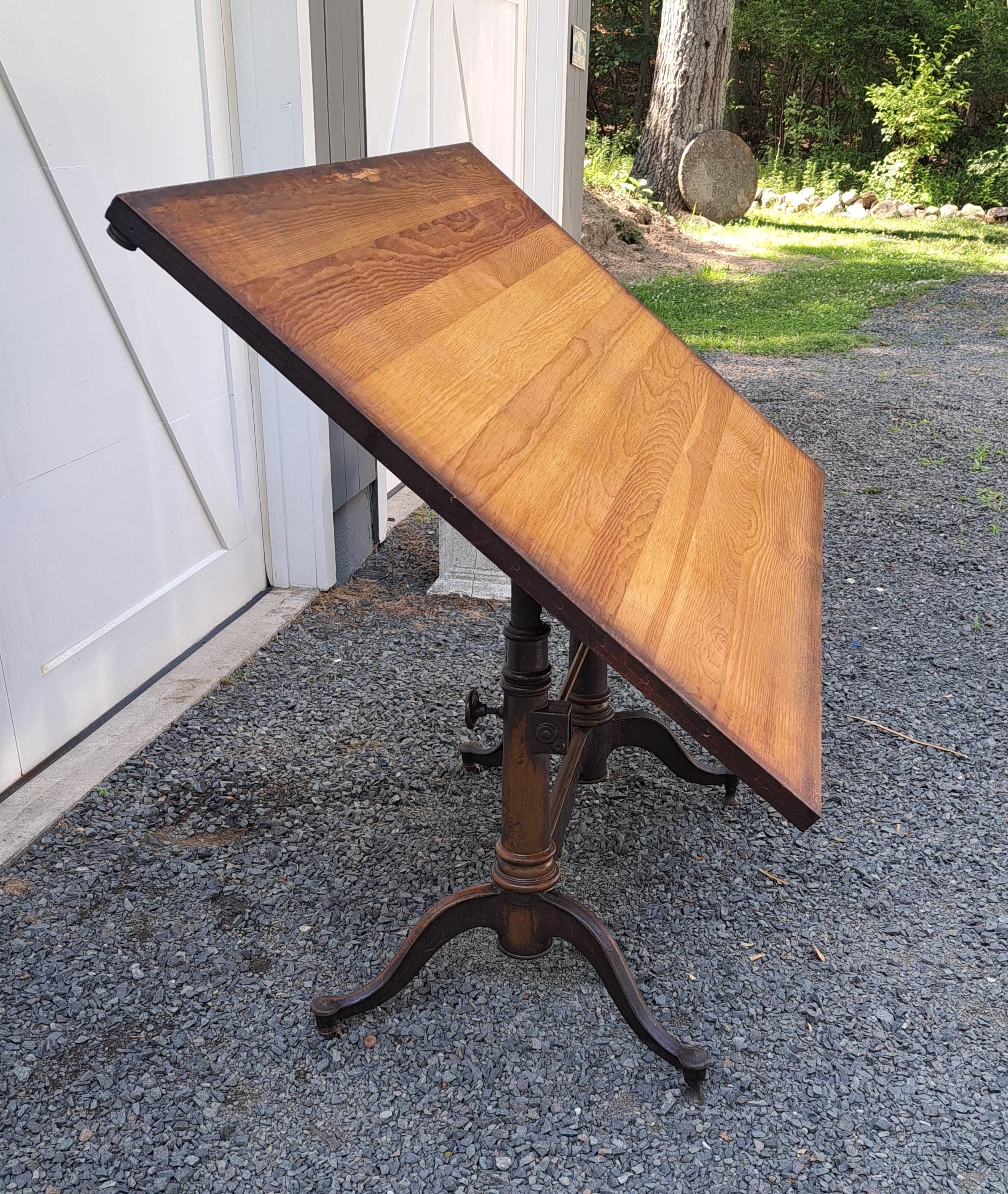 Dietzgen Cast Iron Double Pedestal Drafting Table.  The top is 60