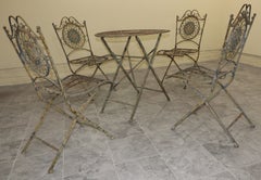 1970s Italian Bistro–Style Wrought Iron Garden Set with Four Folding Chairs