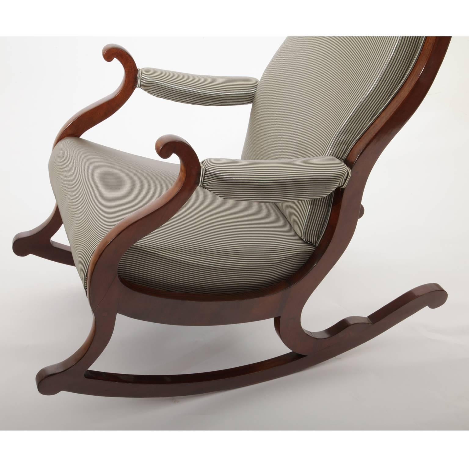 Elegant Biedermeier rocking chair on a sled-shaped base. Newly upholstered.