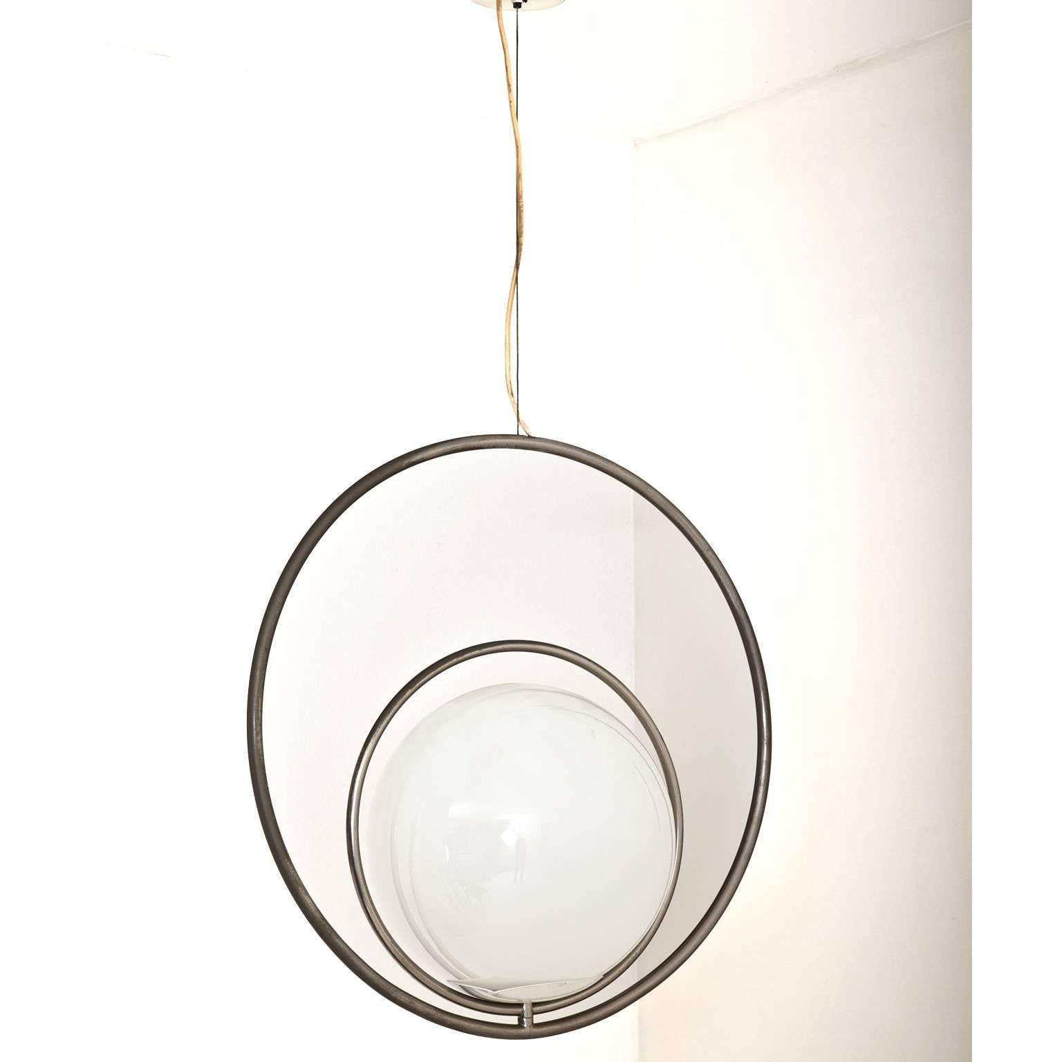 Globe-shaped pendant lamp out of opaque glass with two chromed rings as mounting. The rings are rotatable so the lamp can be hung up in multiple ways.