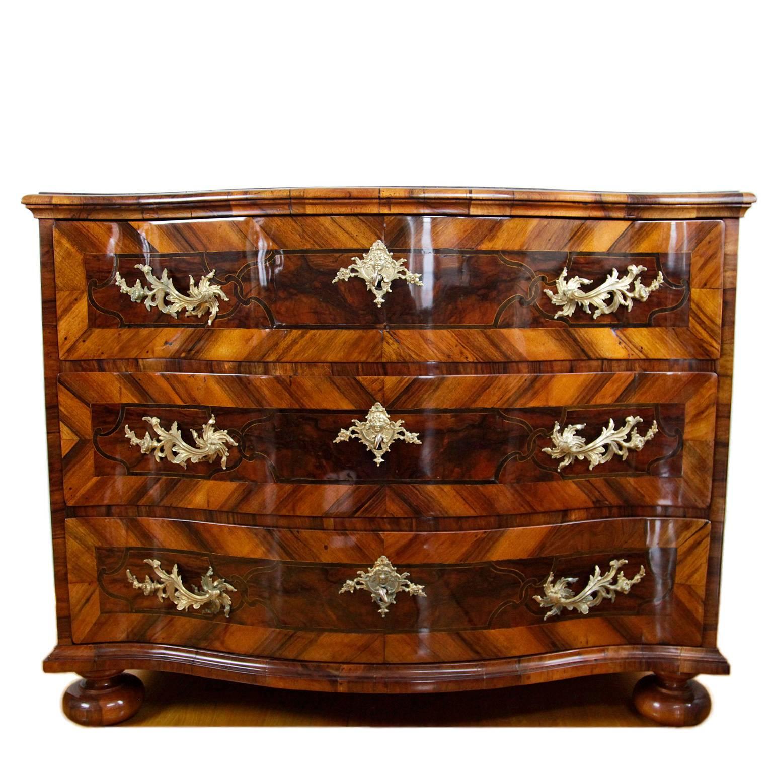 Exceptional Baroque chest of drawers from Munich, circa 1770 with a serpentine front. Walnut veneer with beautiful inlays and ormolu fittings.

 