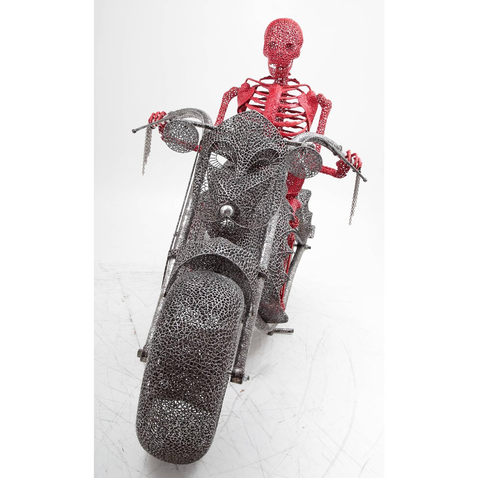 Lifesize sculpture of a motorcycle made out of individually welded rods, ridden by a red-coloured skeleton. The skeleton is not attached to the chopper and can be seperated from it.
Designer Anacleto Spazzapan considers himself to be in the service