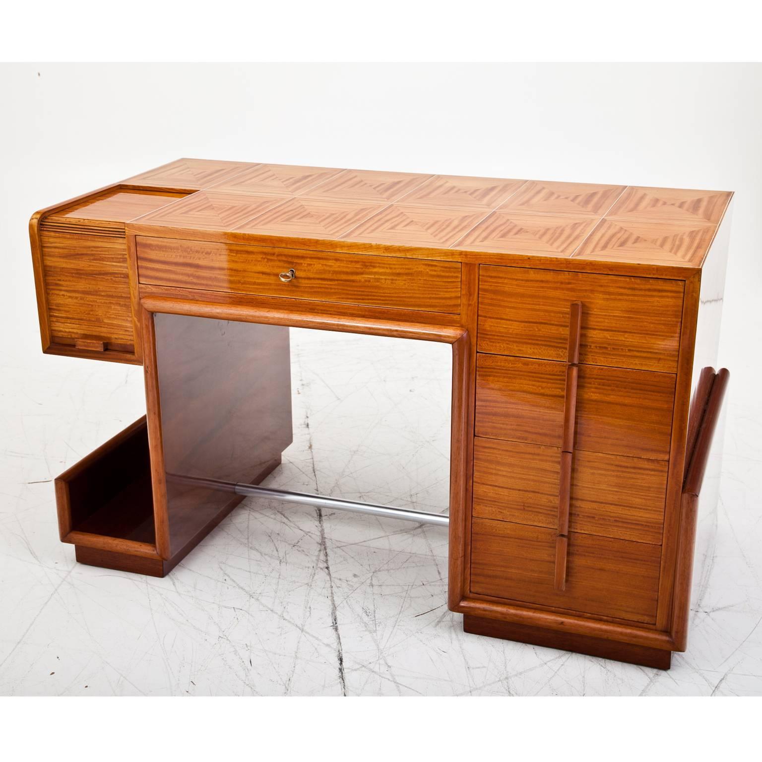 Small Art Deco desk with shelfing space on the side, five drawers and a compartment with shutter lid. The surface shows a very beautiful veneer pattern. The desk was professionally restored.